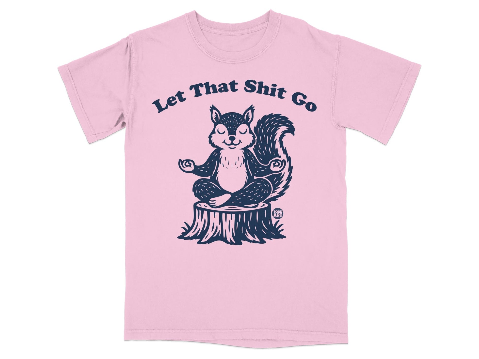 Pink t-shirt with a squirrel meditating on a tree stump, text reads "Let That Shit Go".