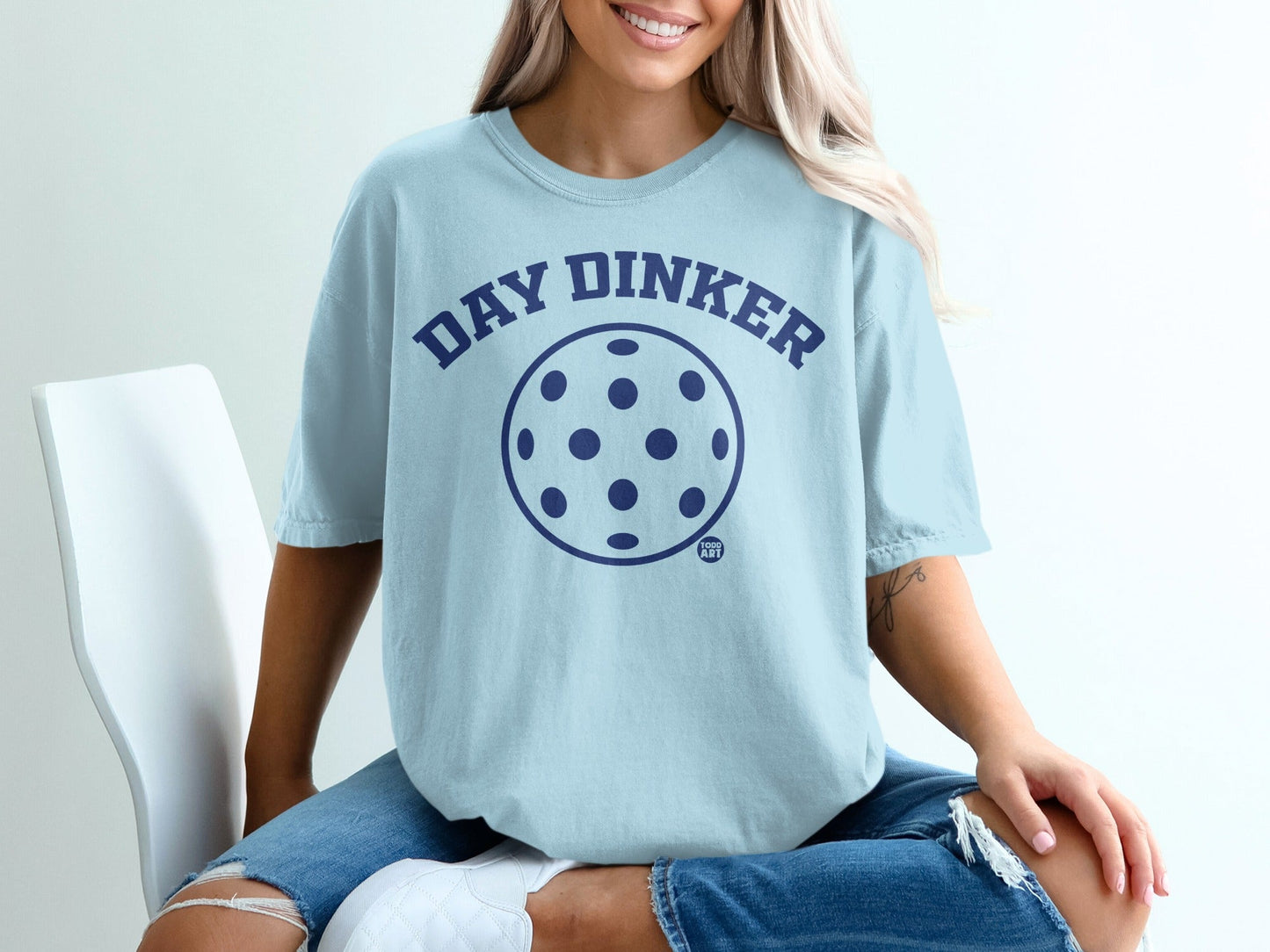 Light blue t-shirt with "DAY DINKER" and a pickleball graphic.