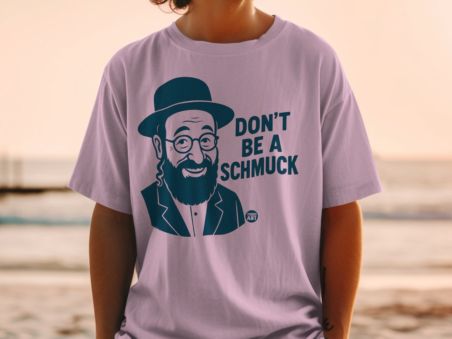 T-shirt with illustration of a man in a hat and glasses, saying "DON'T BE A SCHMUCK".