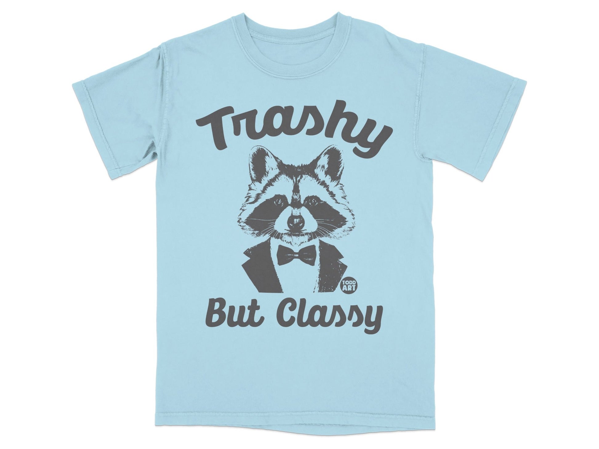 Light blue t-shirt with a raccoon wearing a tuxedo and the text "Trashy But Classy".