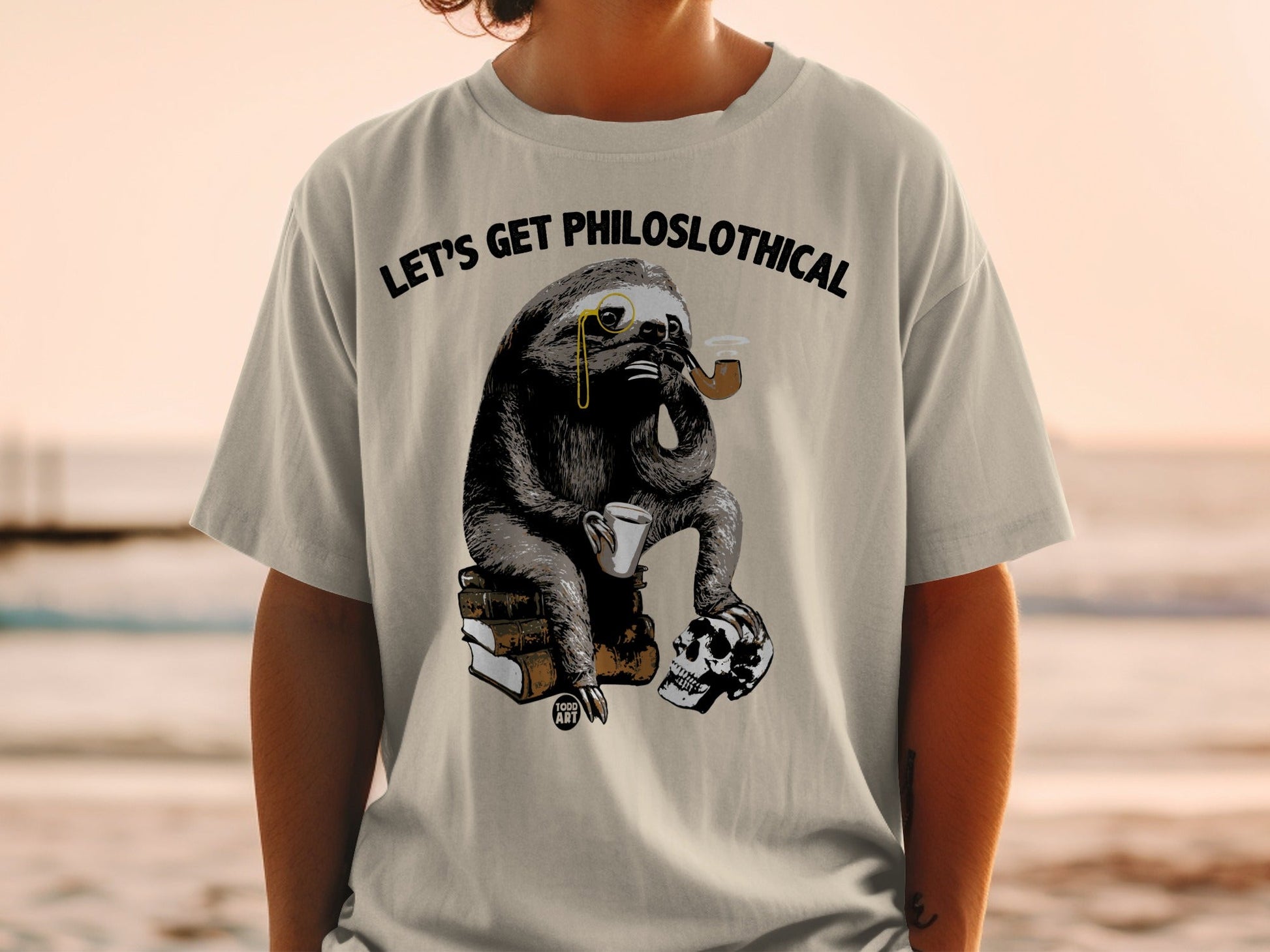 Sloth wearing monocle, smoking pipe, holding coffee cup, sitting on books and skull.