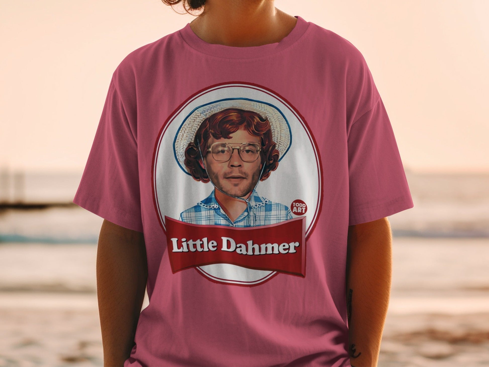 T-shirt featuring a portrait with "Little Dahmer" text in a red banner.