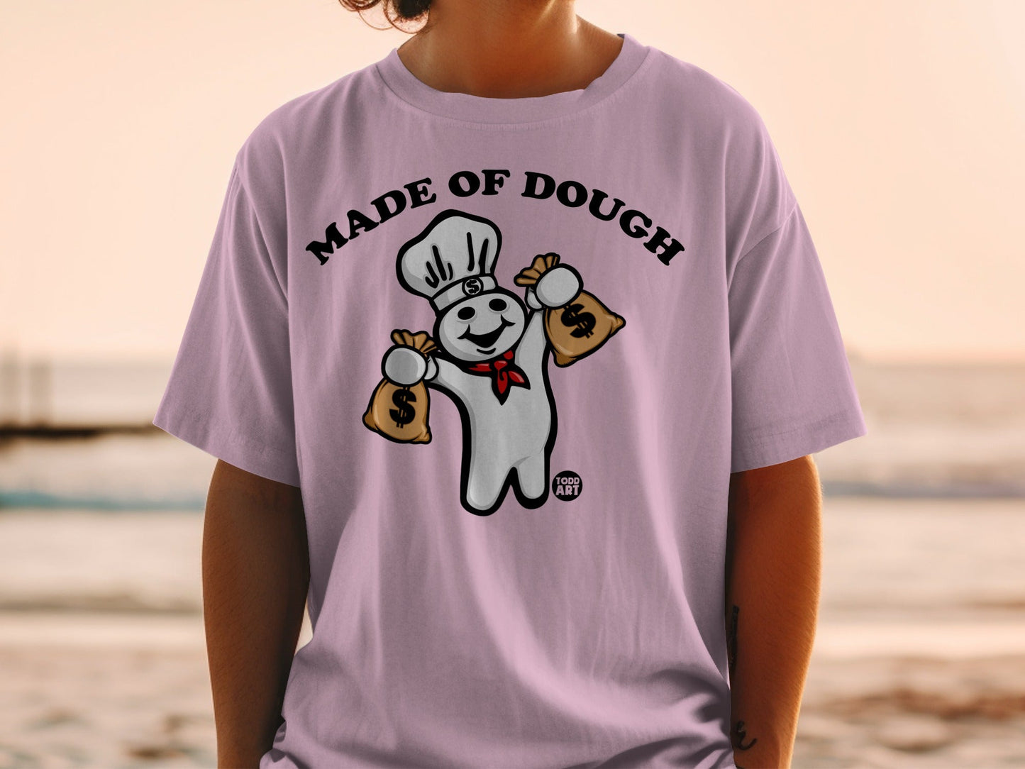 Pillsbury Doughboy wearing chef hat holding money bags, text "MADE OF DOUGH".