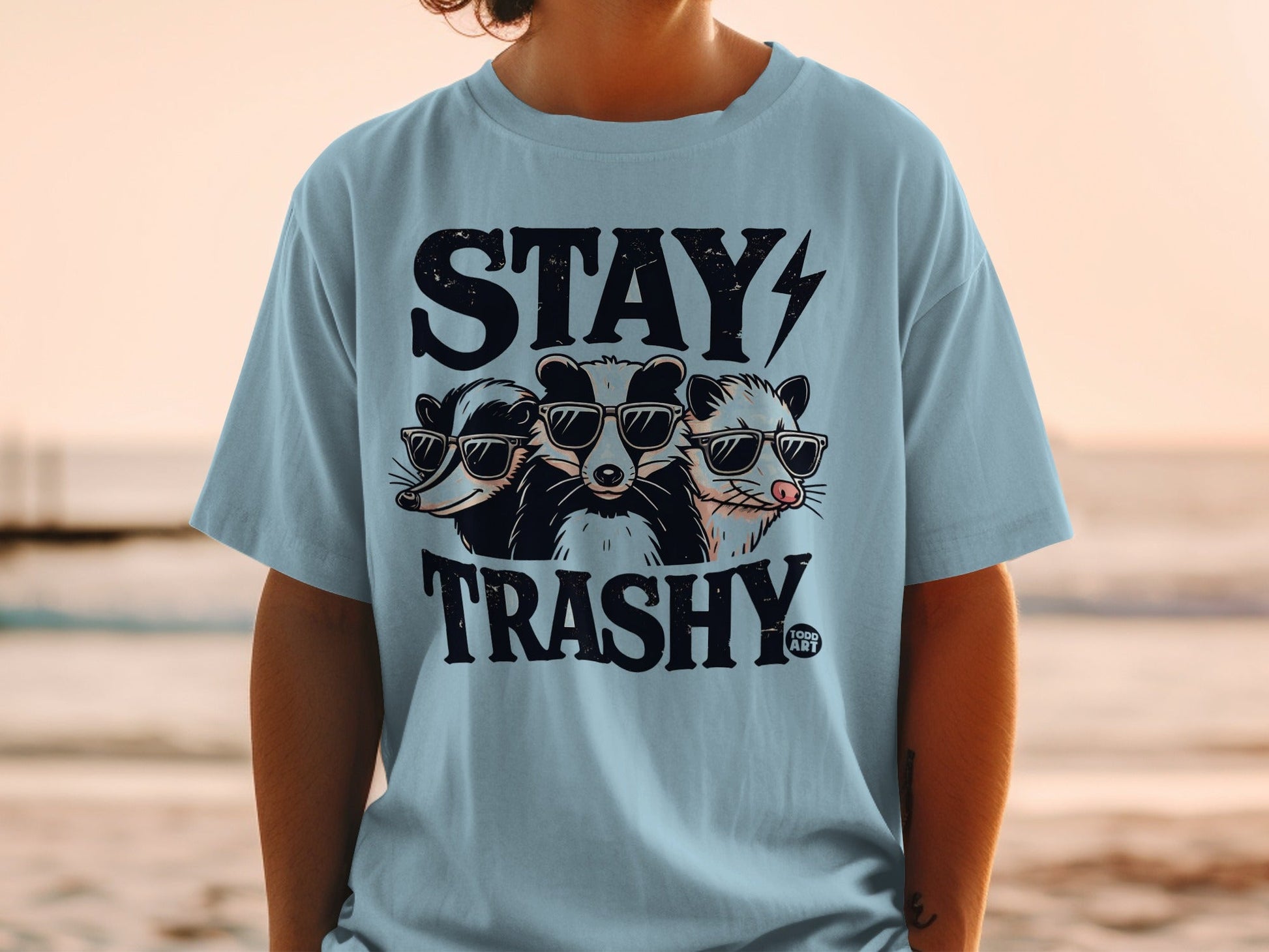 Three cartoon animals wearing sunglasses, with "STAY TRASHY" text.