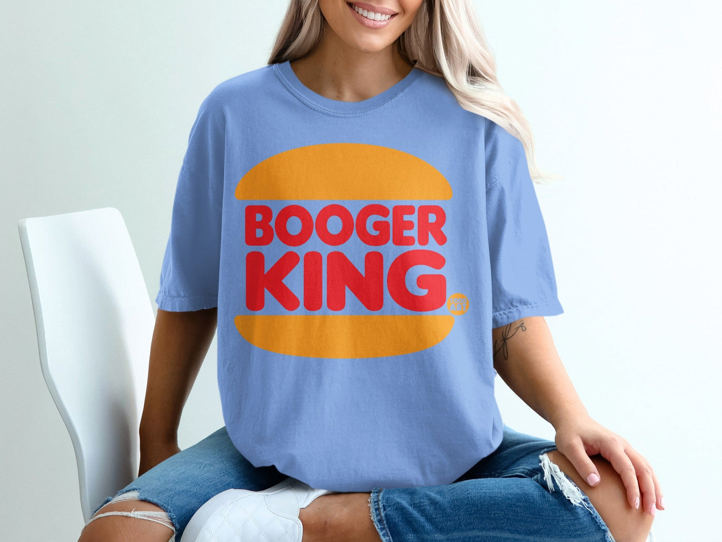 Light blue t-shirt with "BOOGER KING" in red text on a burger bun design.