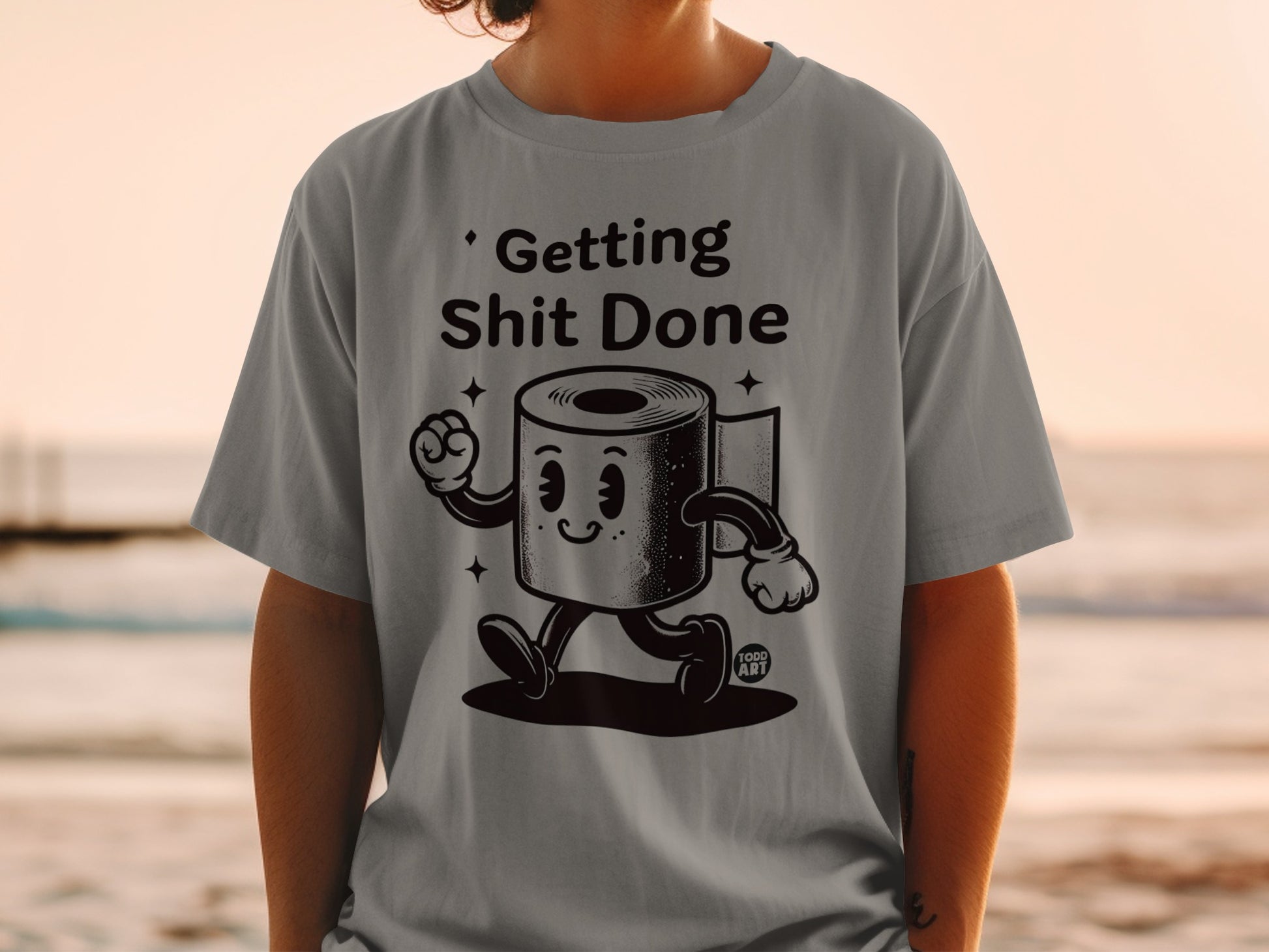 T-shirt with cartoon toilet paper roll saying "Getting Shit Done".