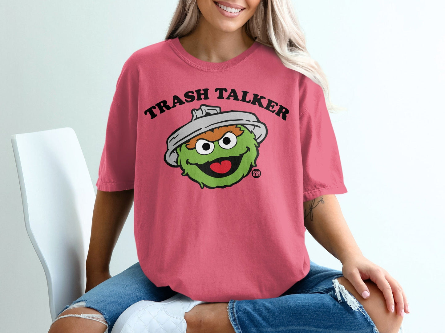 Oscar the Grouch on a pink t-shirt with "Trash Talker" text.