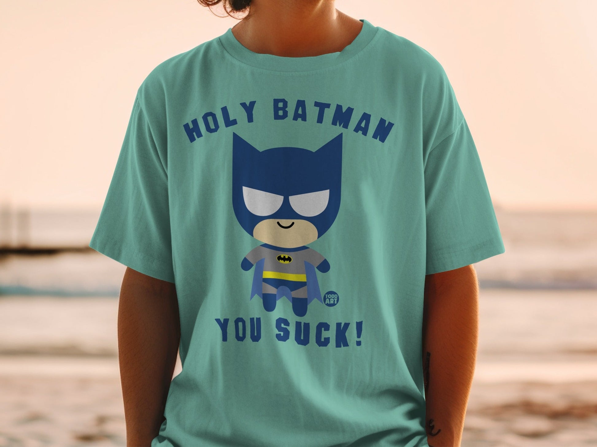 Chibi Batman graphic t-shirt with "Holy Batman, You Suck!" text.