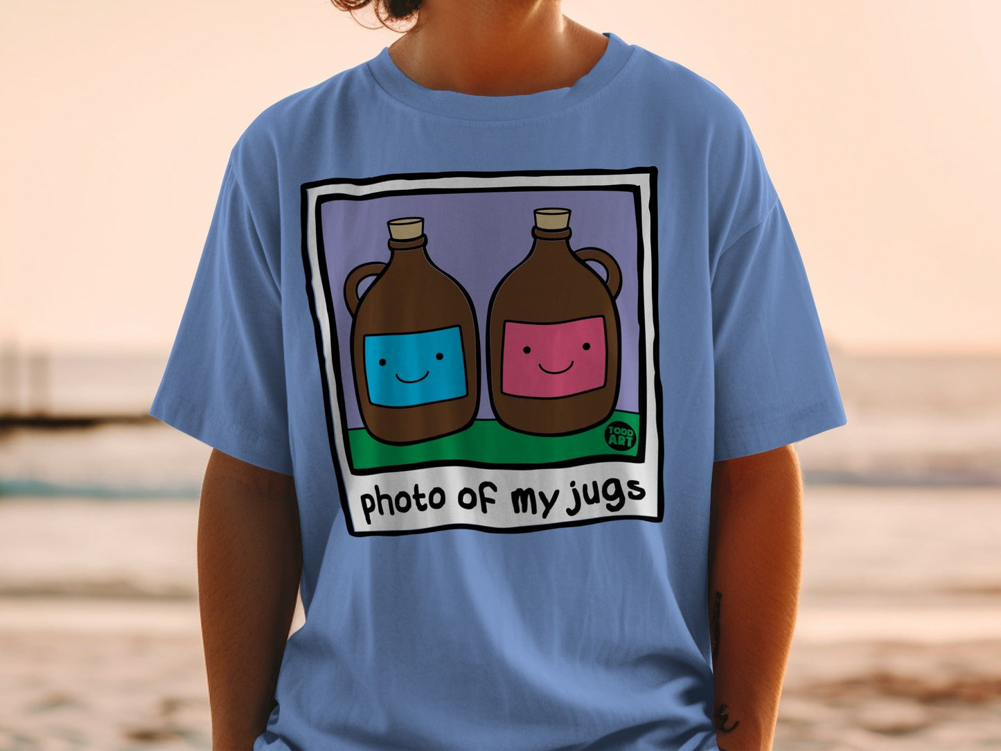 Two jugs, one blue and one pink, with smiling faces on a t-shirt.
