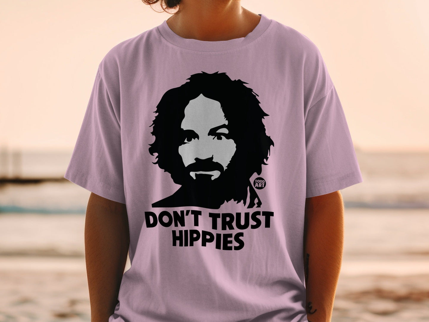 T-shirt with black silhouette of man, "DON'T TRUST HIPPIES" text, and "GOOD ART" logo.