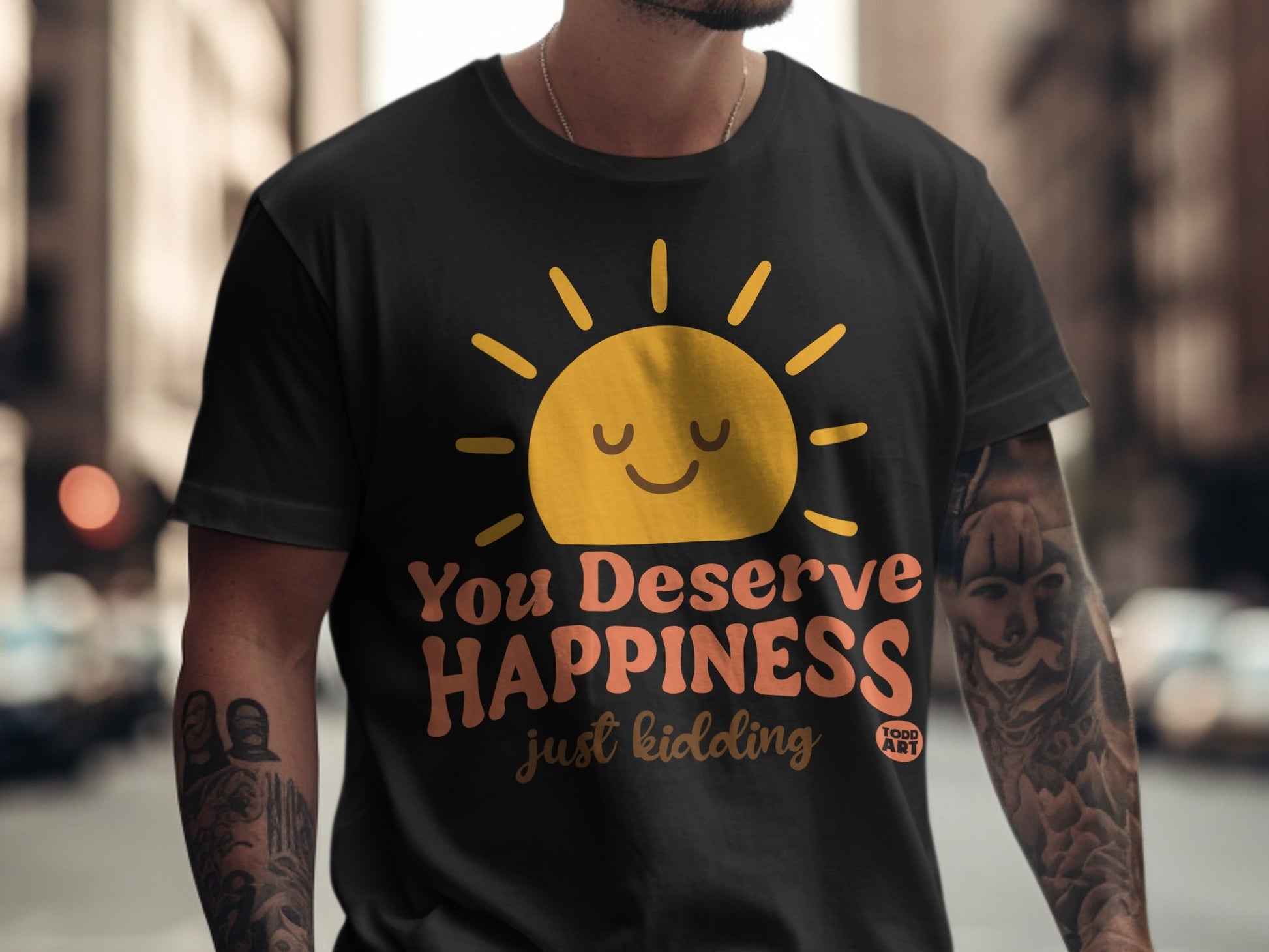 Black t-shirt with yellow sun graphic and "You Deserve Happiness" text.