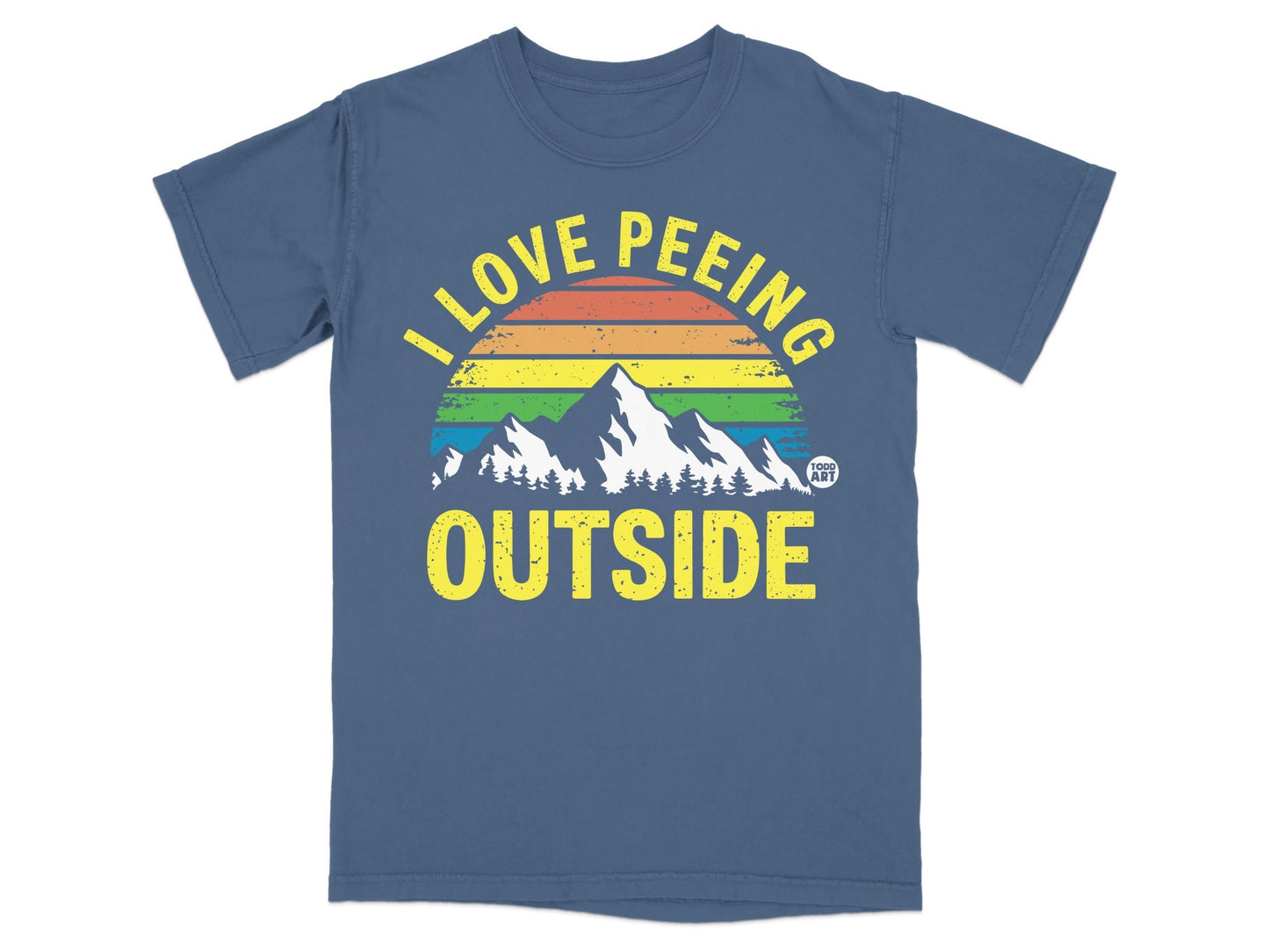 T-shirt with "I love peeing outside" text over mountains and rainbow.