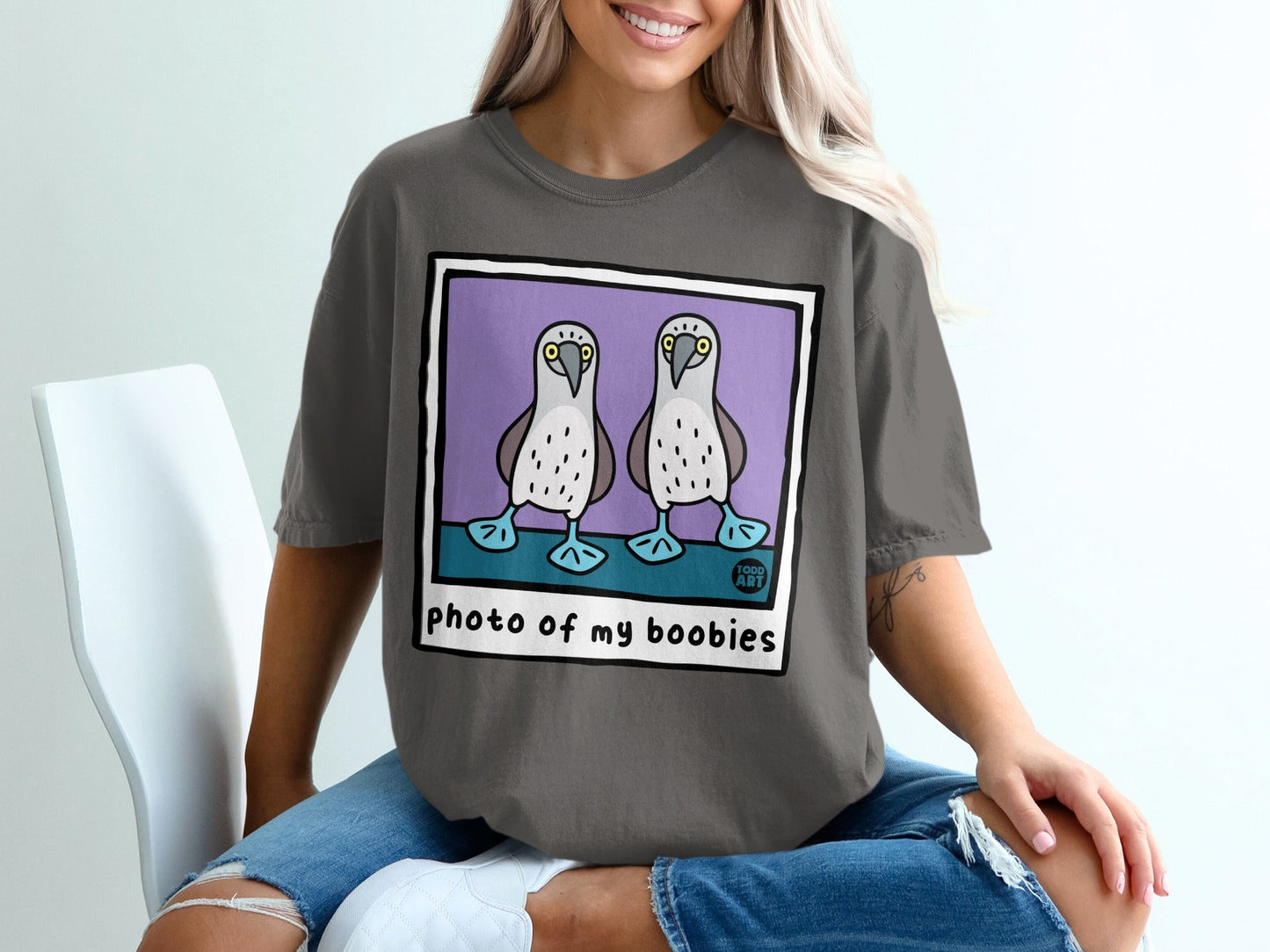 Two boobies on a purple background, with "photo of my boobies" text.