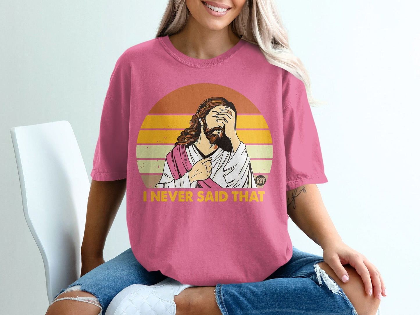 Pink t-shirt with Jesus graphic and text "I Never Said That".