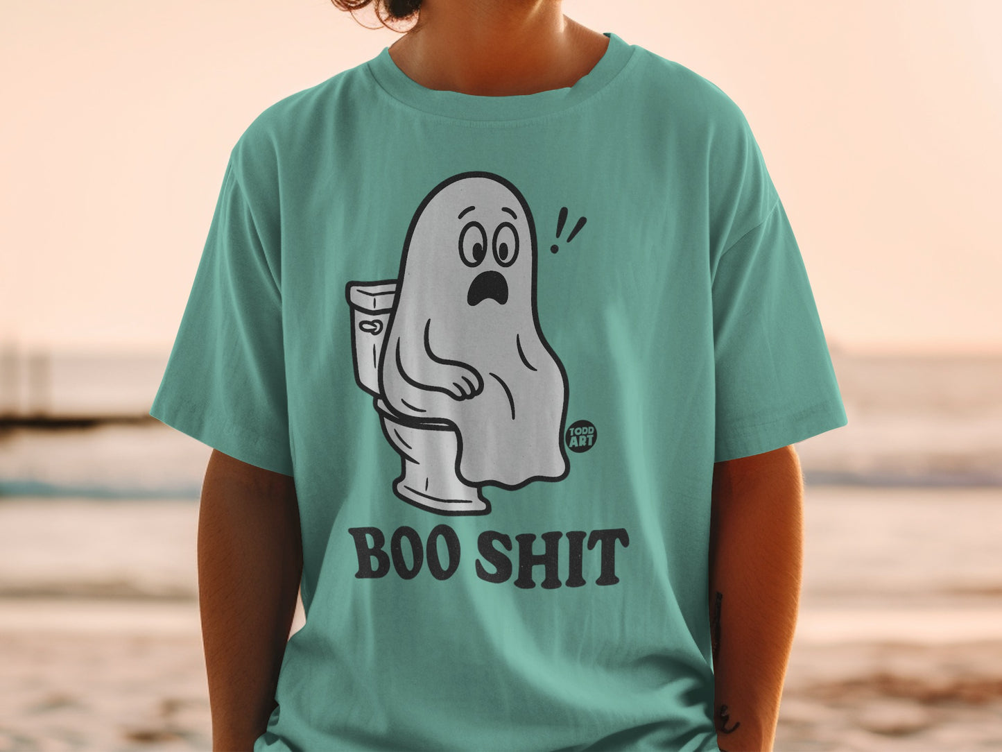 Ghost sitting on toilet, wearing "BOO SHIT" t-shirt.