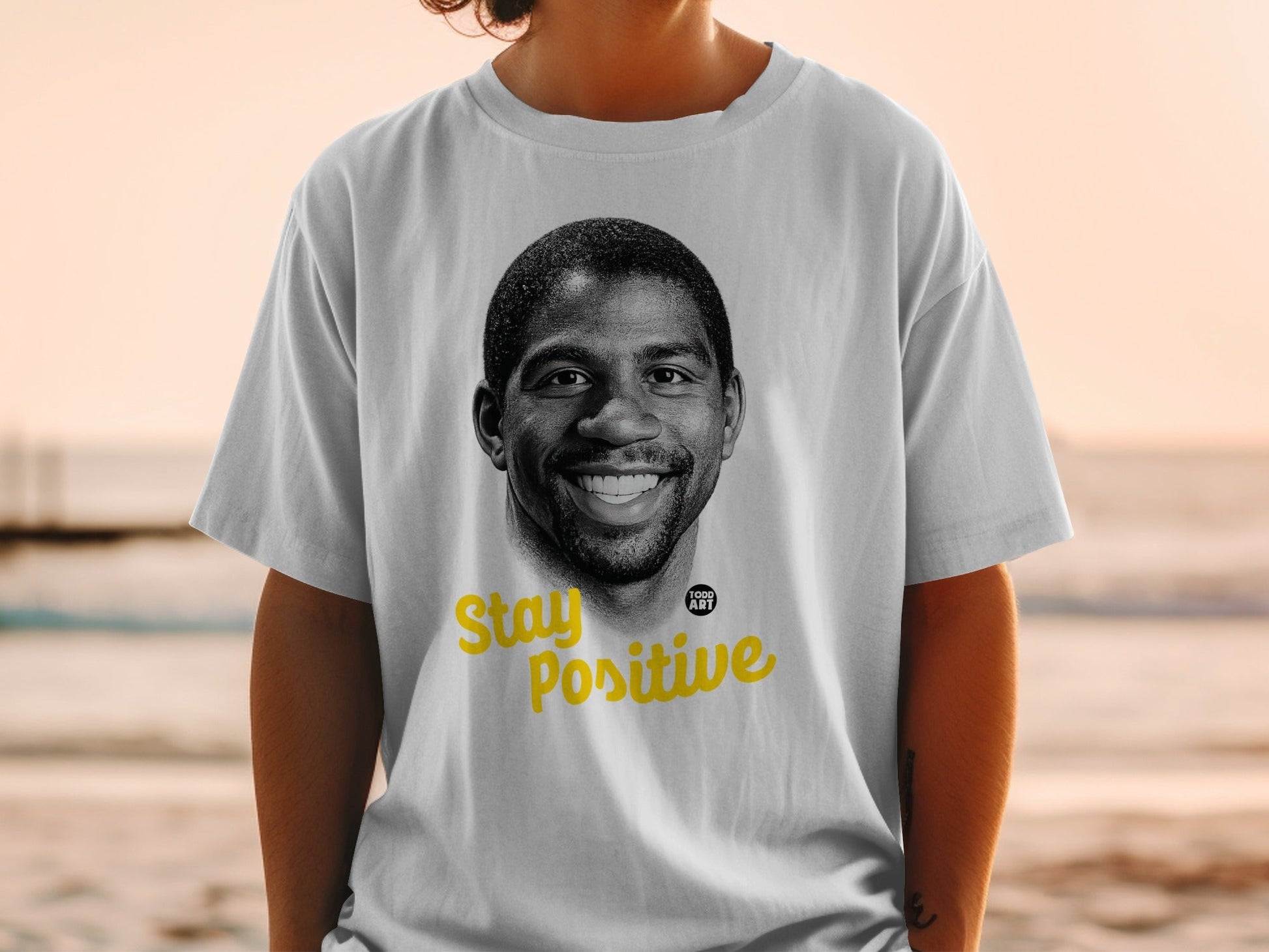 T-shirt with Magic Johnson portrait and "Stay Positive" text.