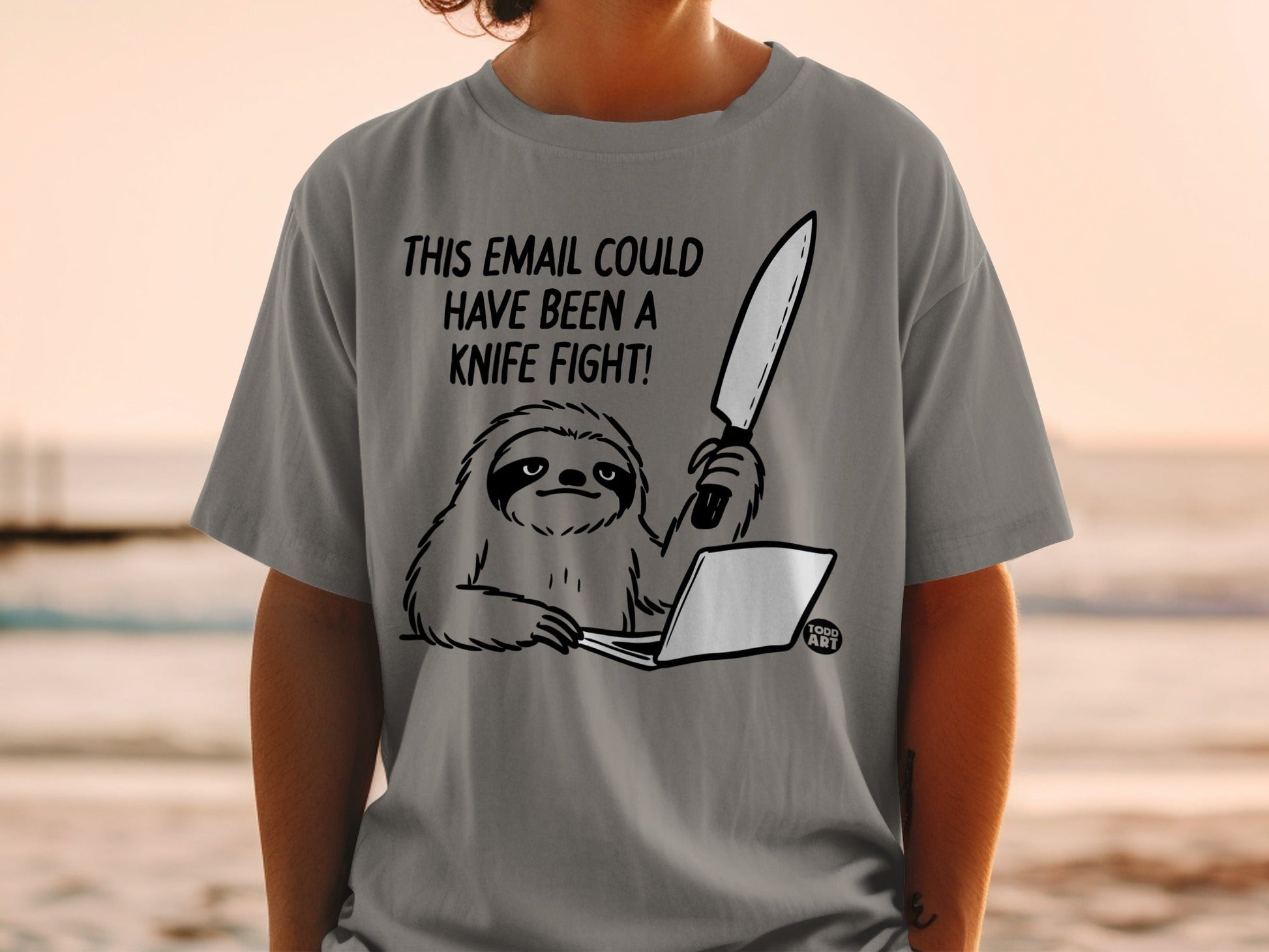 T-shirt with a sloth holding a knife to a laptop, text reads "This email could have been a knife fight."
