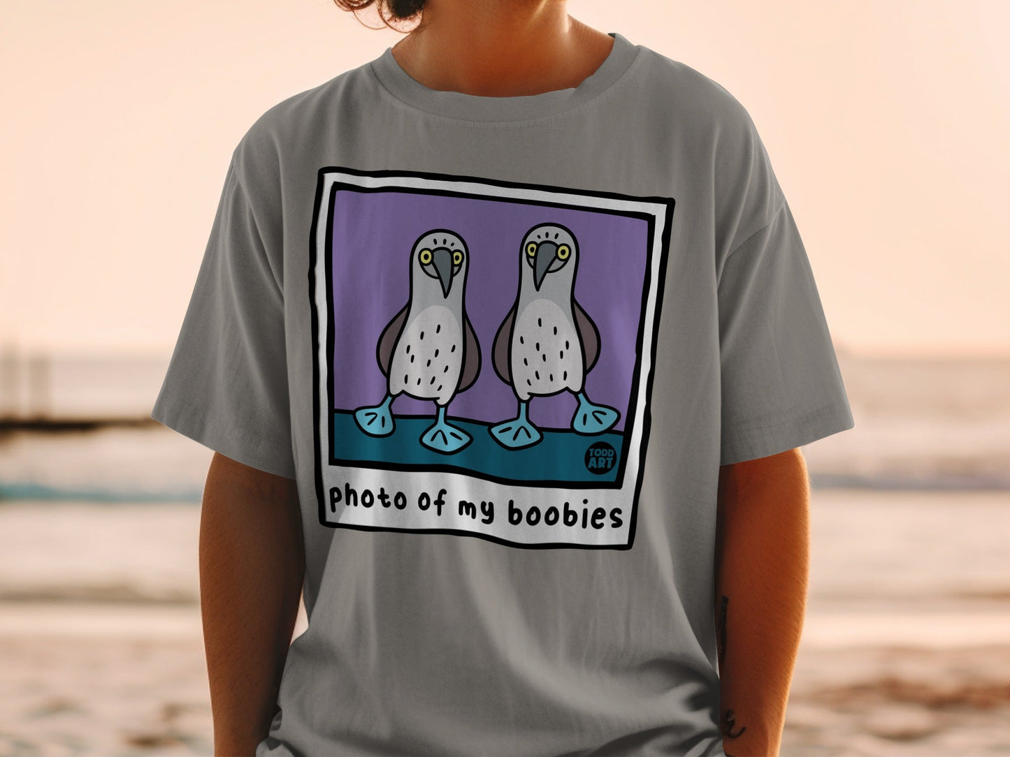 T-shirt with cartoon boobies and text "photo of my boobies."