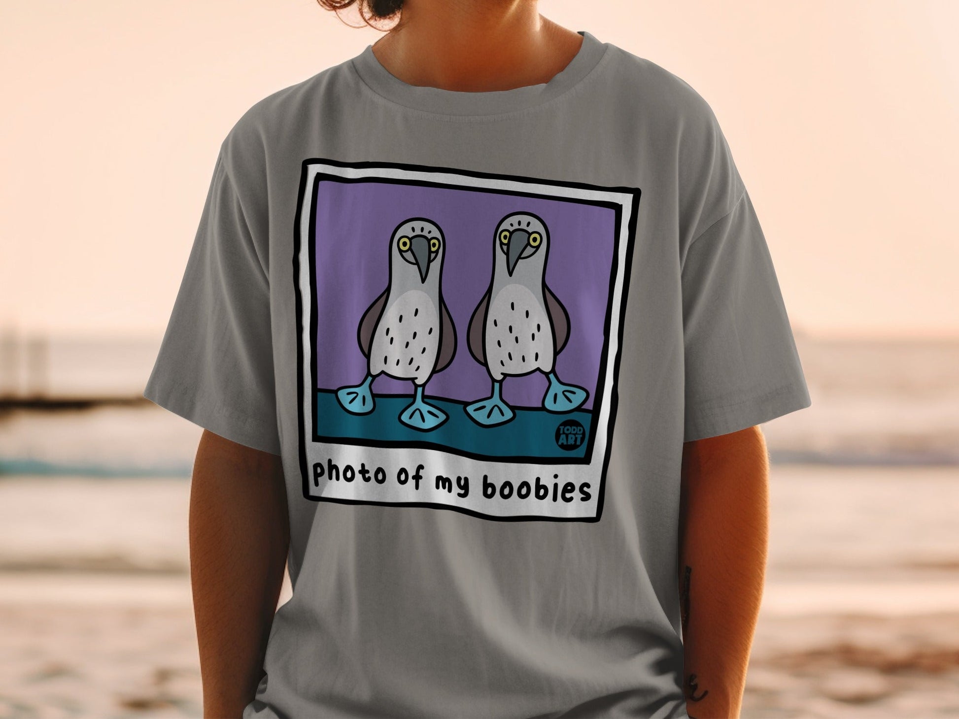 T-shirt with cartoon boobies and text "photo of my boobies."