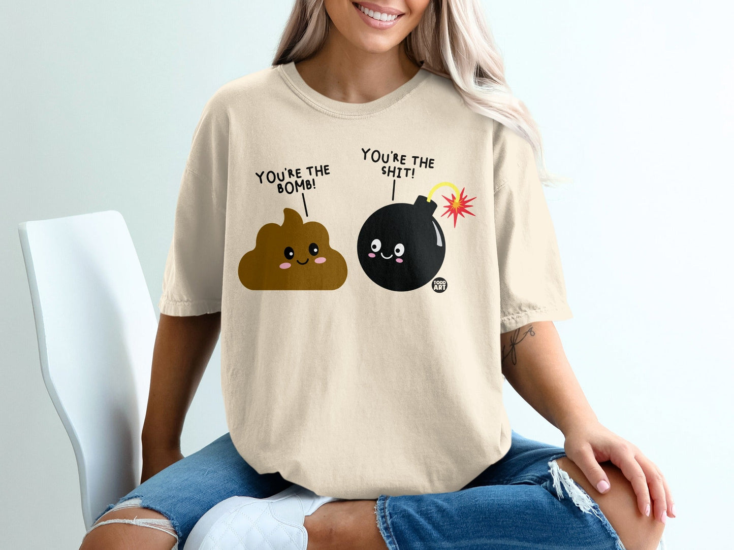 T-shirt with cartoon poop and bomb characters saying "You're the bomb!" and "You're the sh*t!".