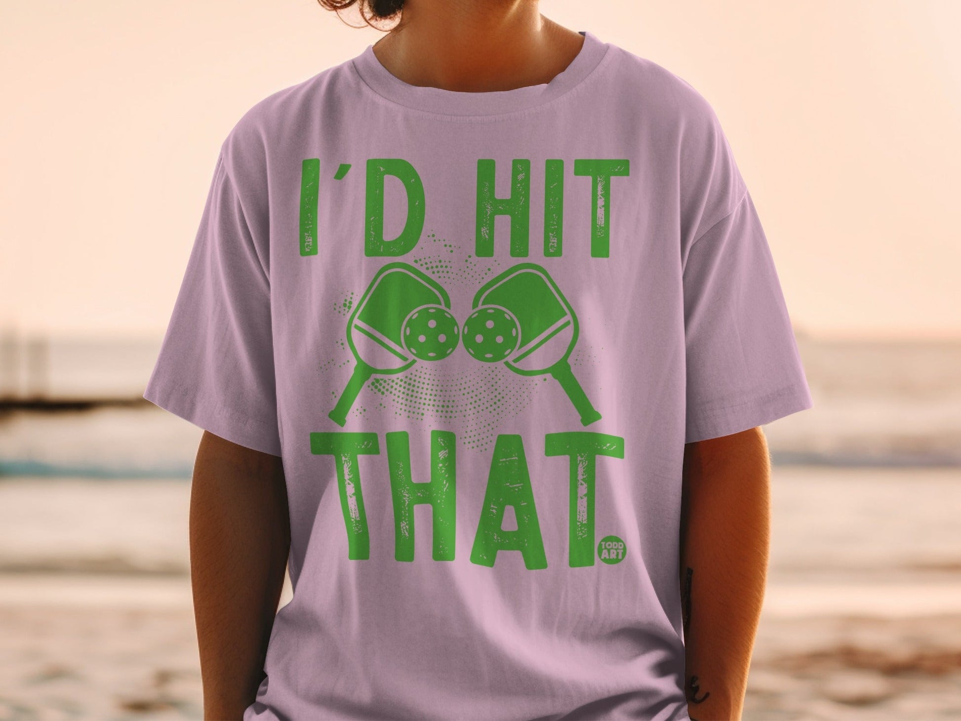 Pickleball paddles and balls with text "I'D HIT THAT."