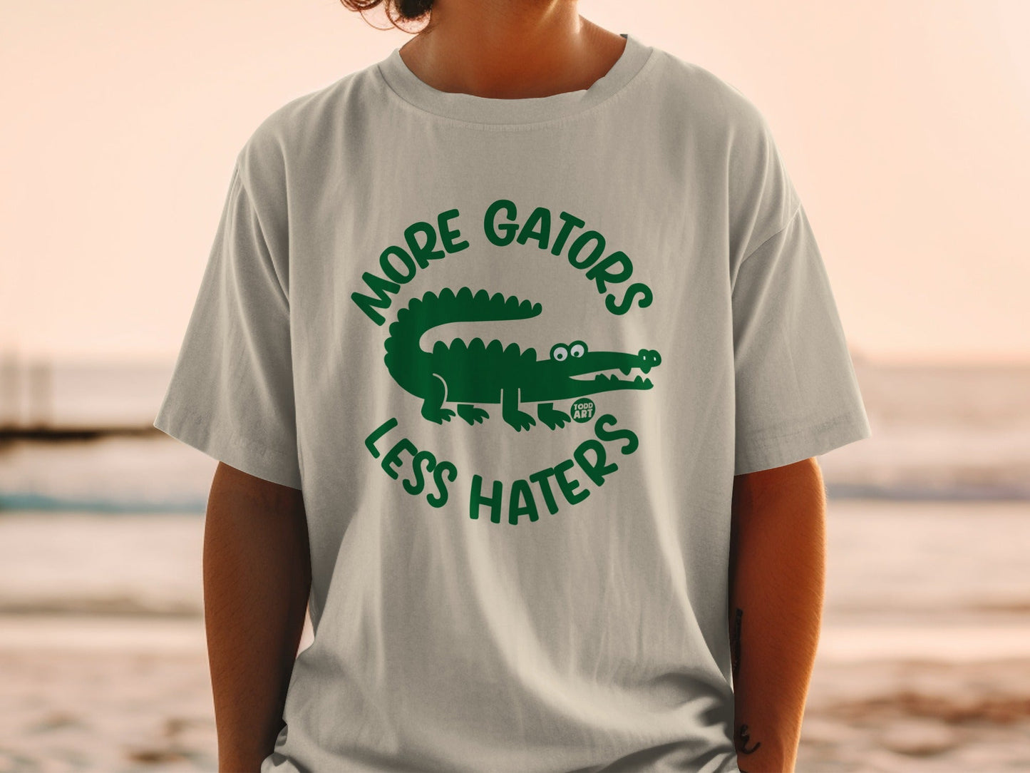 T-shirt with "More Gators Less Haters" text and alligator graphic.