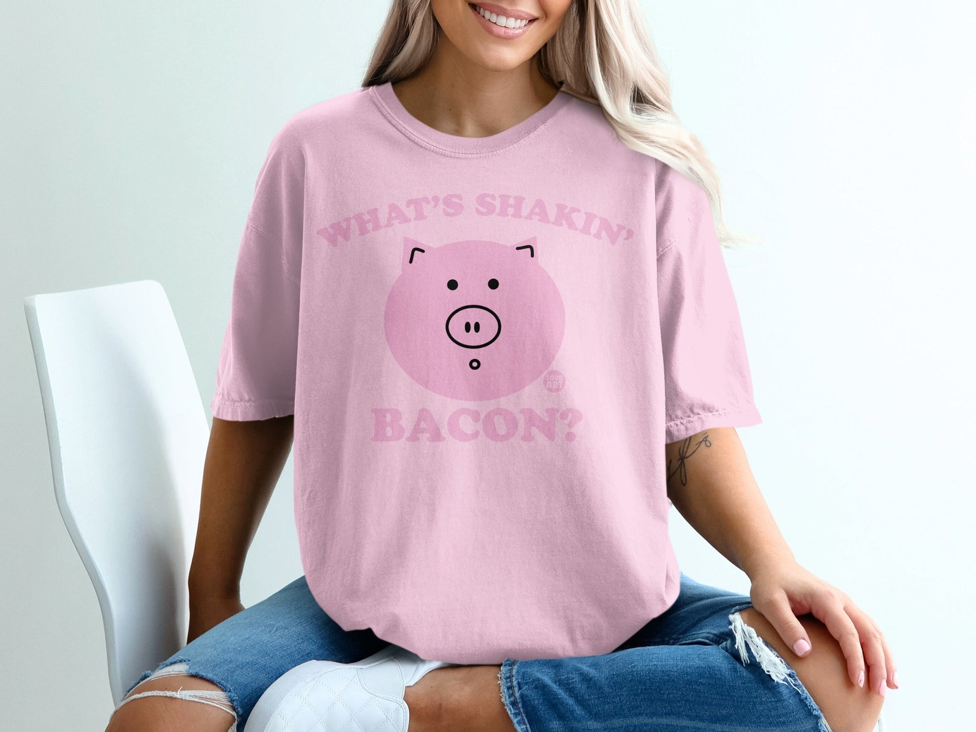 Pink t-shirt with a cartoon pig and "What's Shakin' Bacon?" text.