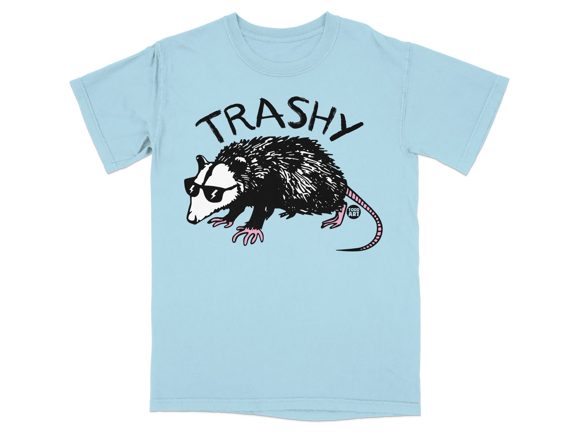 Light blue t-shirt with a "TRASHY" possum wearing sunglasses and pink gloves.