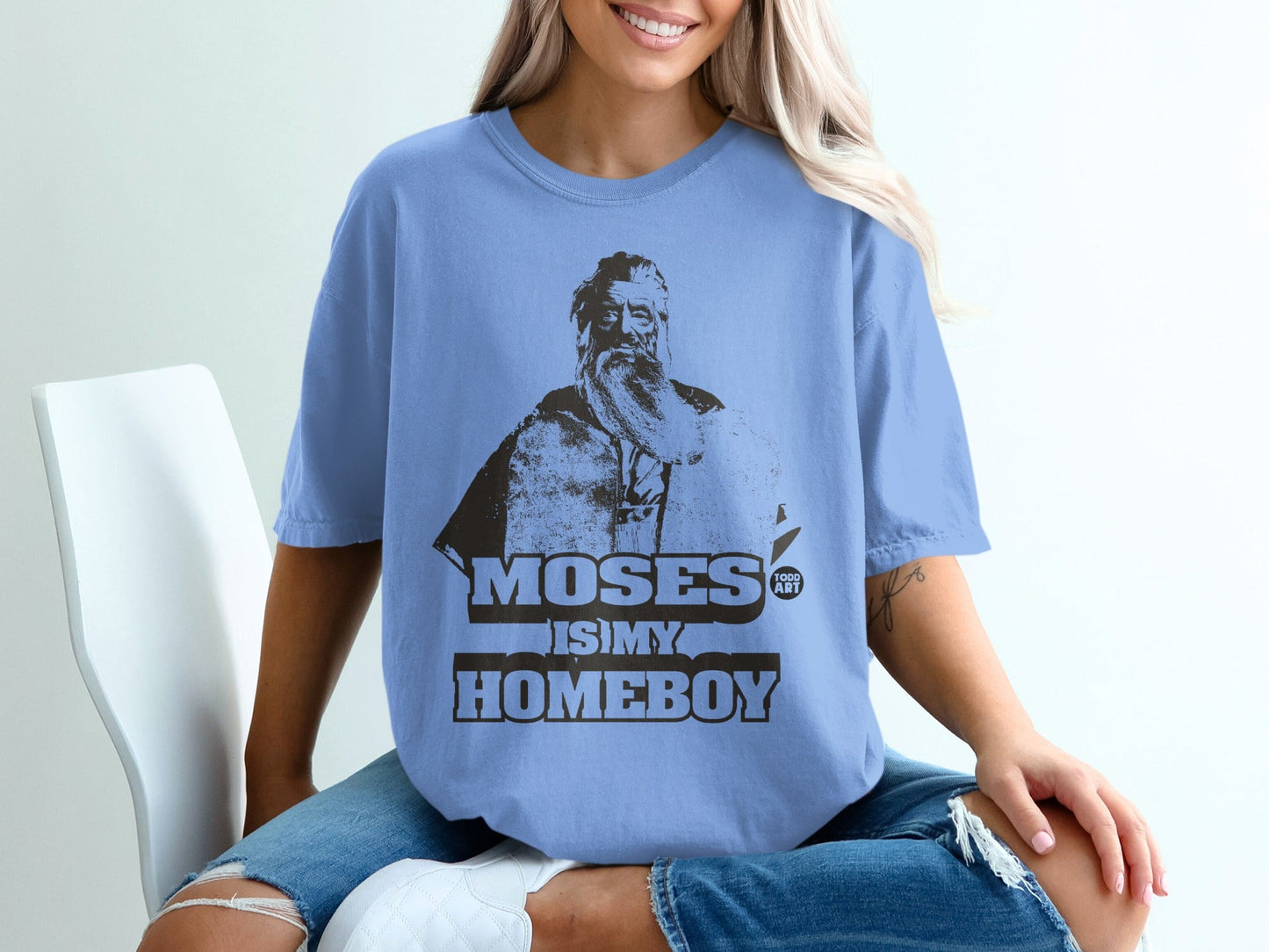 Light blue t-shirt with graphic of Moses and text "Moses is my Homeboy".