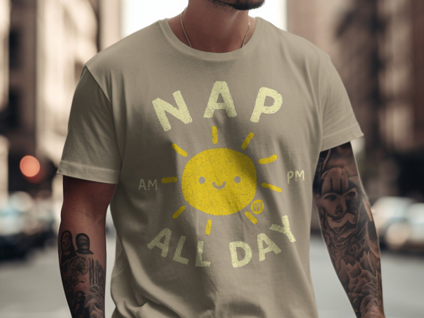 T-shirt with yellow sun graphic and text "NAP ALL DAY".