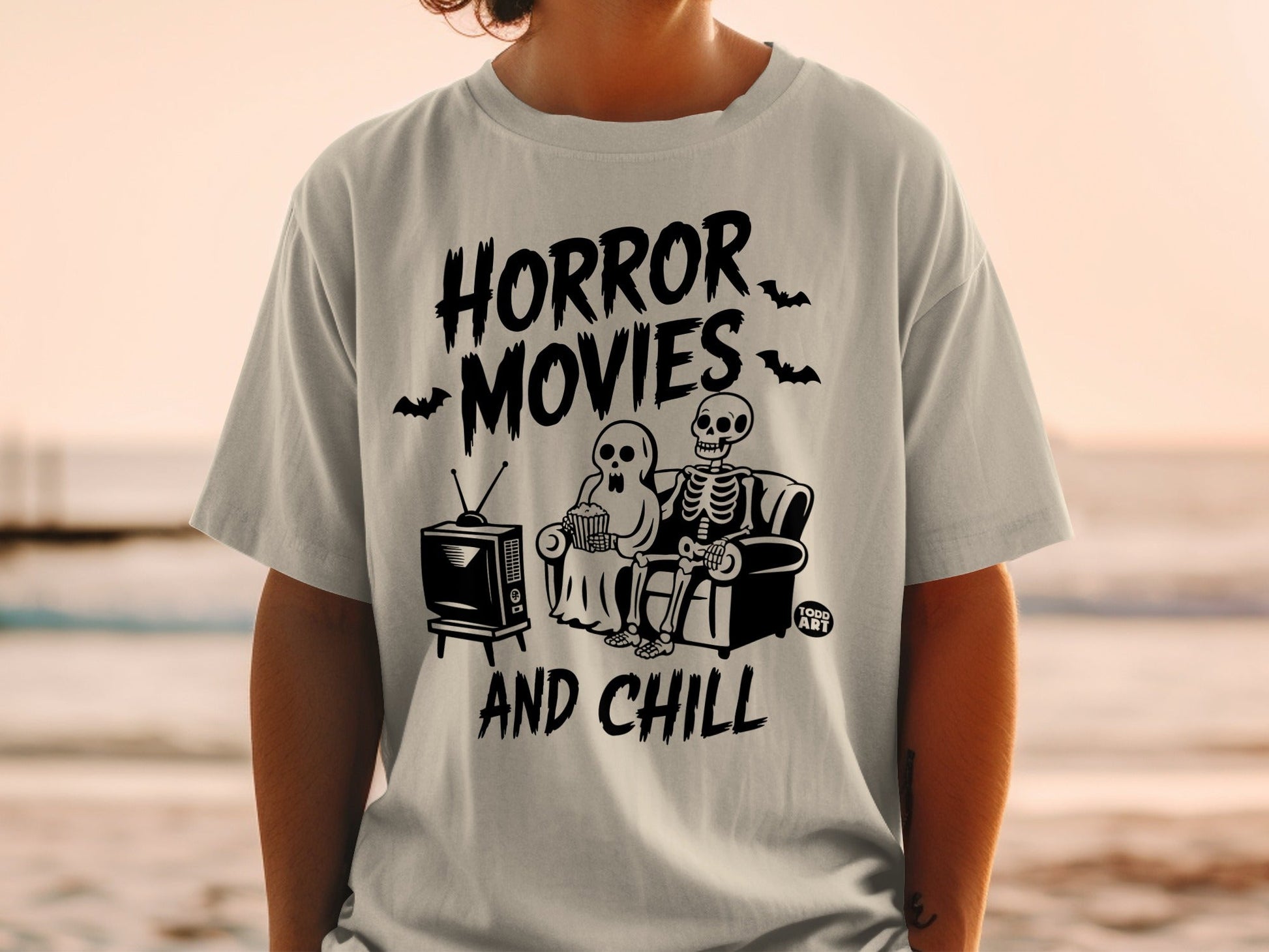Horror movies and chill t-shirt with skeleton couple watching TV.
