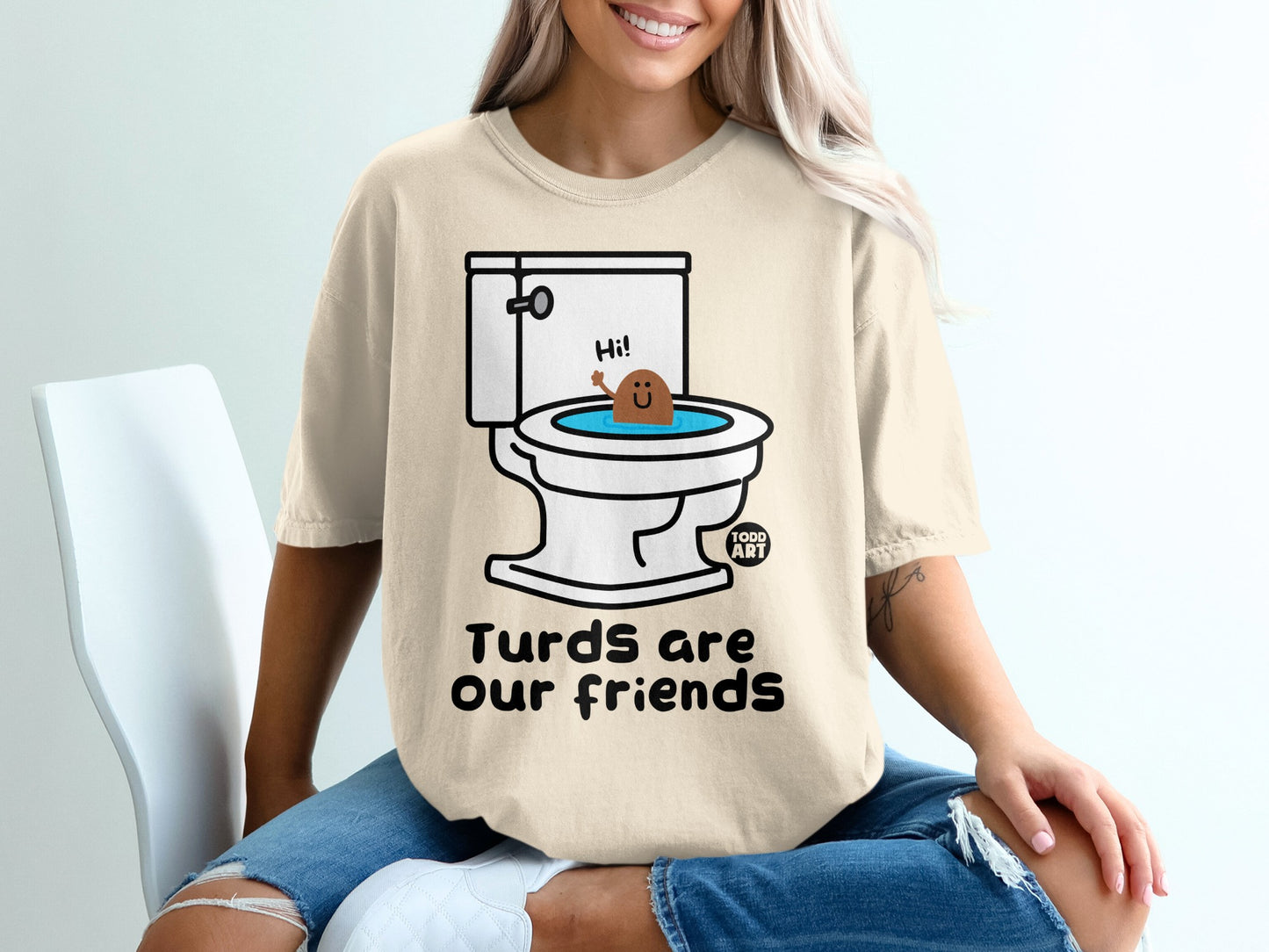 Toilet with smiling poop character and "Turds are our friends" text.