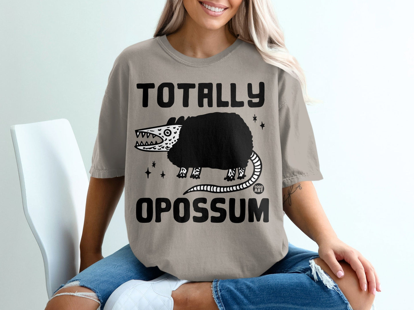 Light gray t-shirt with "Totally Opossum" and cartoon opossum illustration.