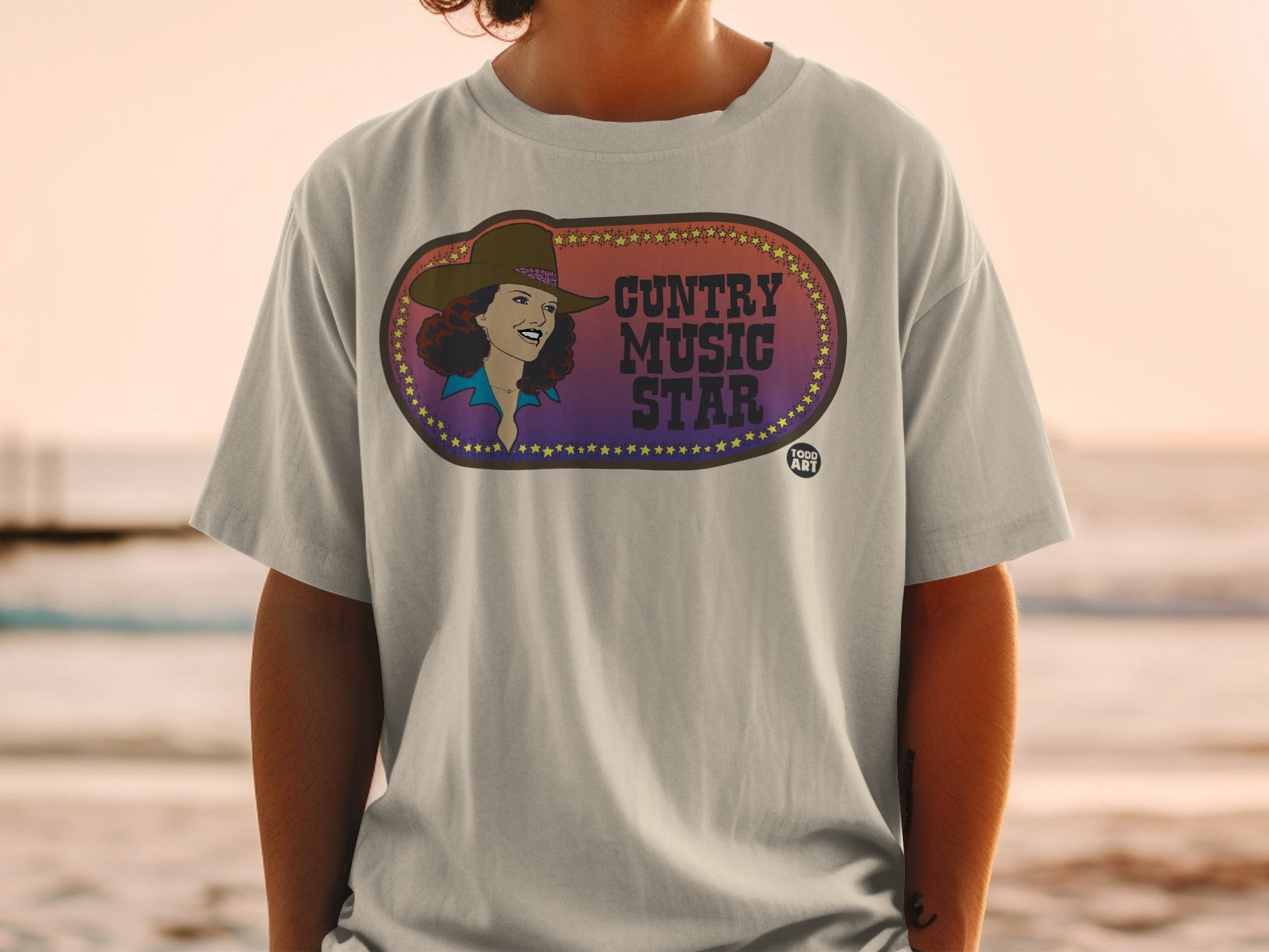 T-shirt with "Country Music Star" text and a woman in a cowboy hat.