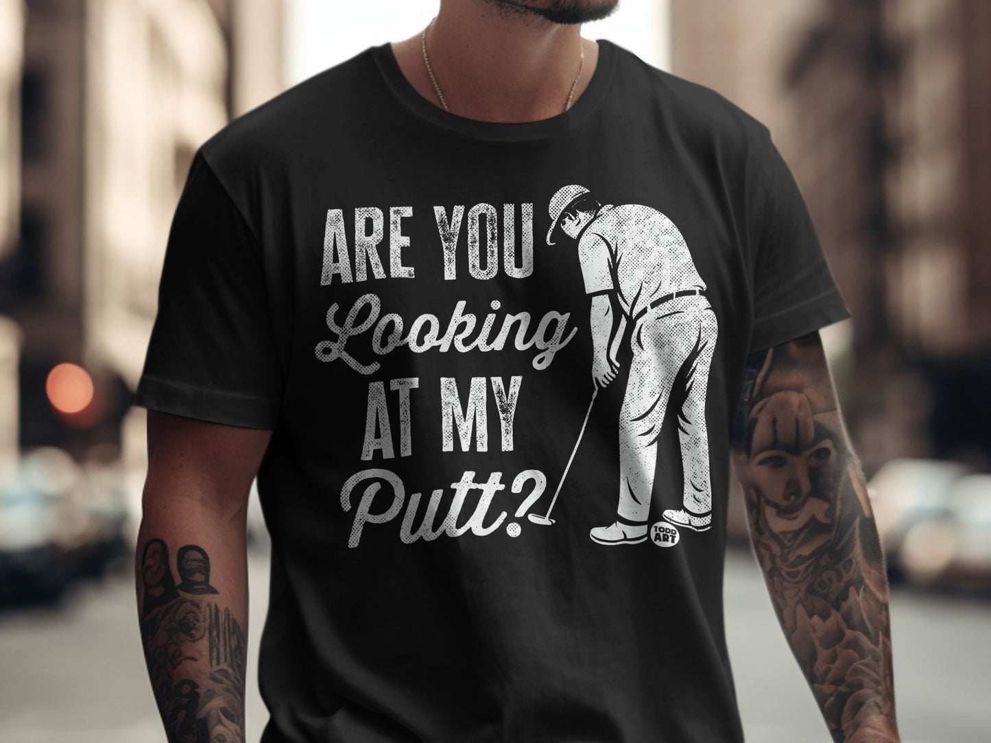 T-shirt with graphic "ARE YOU Looking AT MY Putt?" and golfer illustration.