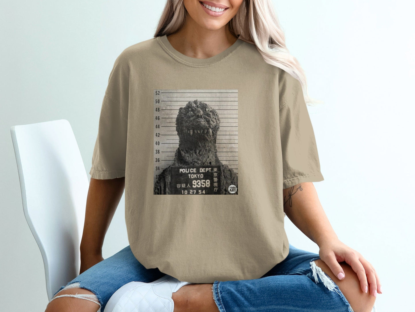 Godzilla mugshot with Tokyo Police Dept. and case number 9358.