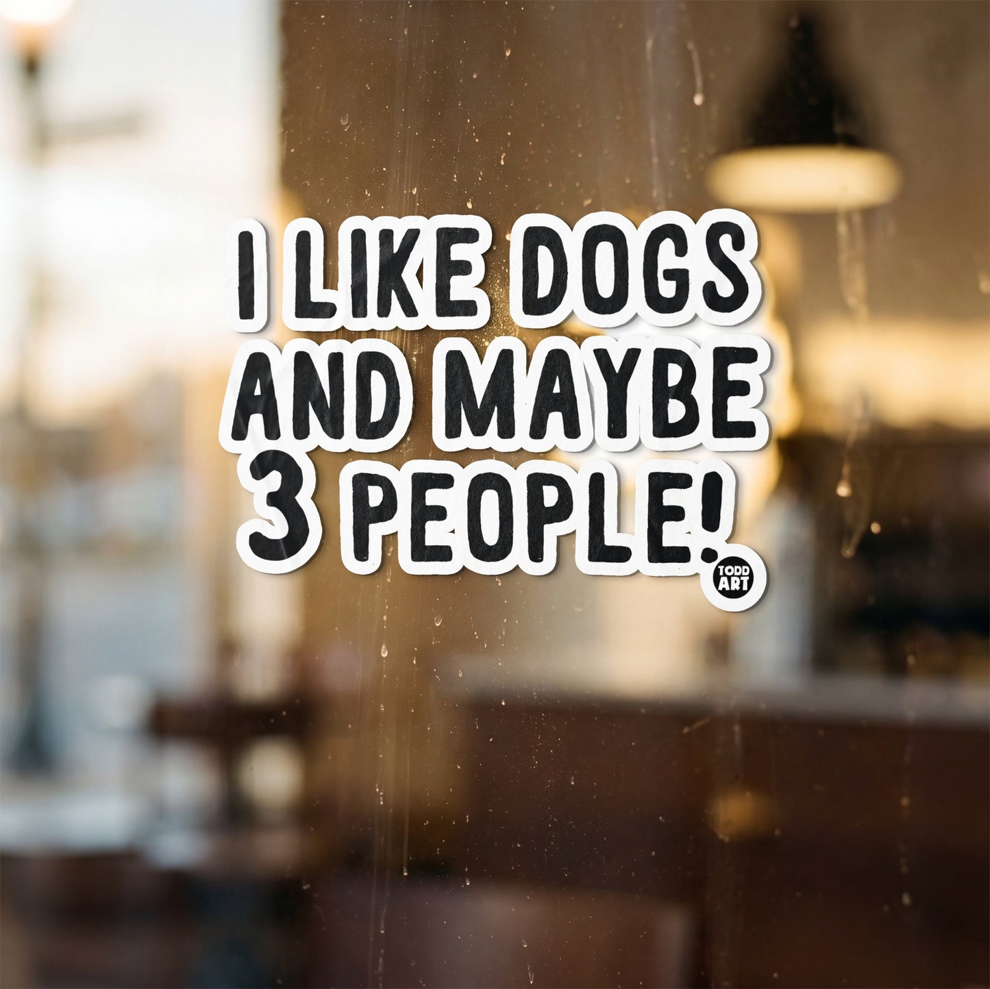 Sticker with text "I LIKE DOGS AND MAYBE 3 PEOPLE!" and a small TODD ART logo.