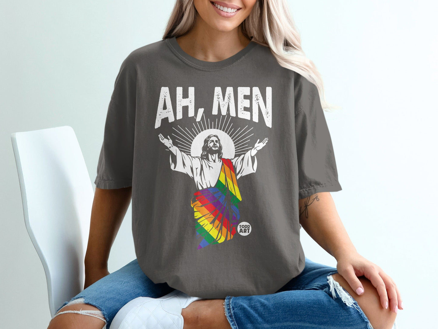 Jesus wearing rainbow flag shirt with "AH, MEN" text.