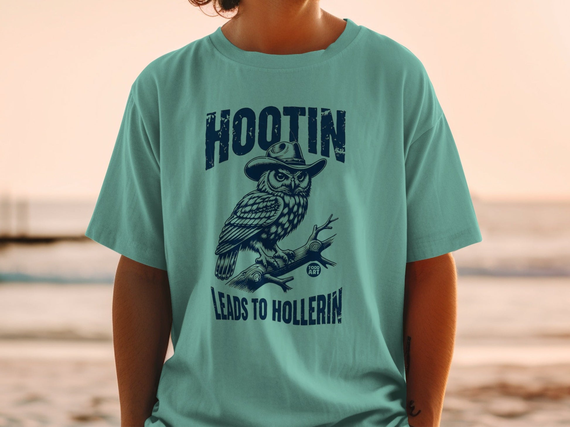 Owl wearing a cowboy hat sits on a branch, text "HOOTIN LEADS TO HOLLERIN".