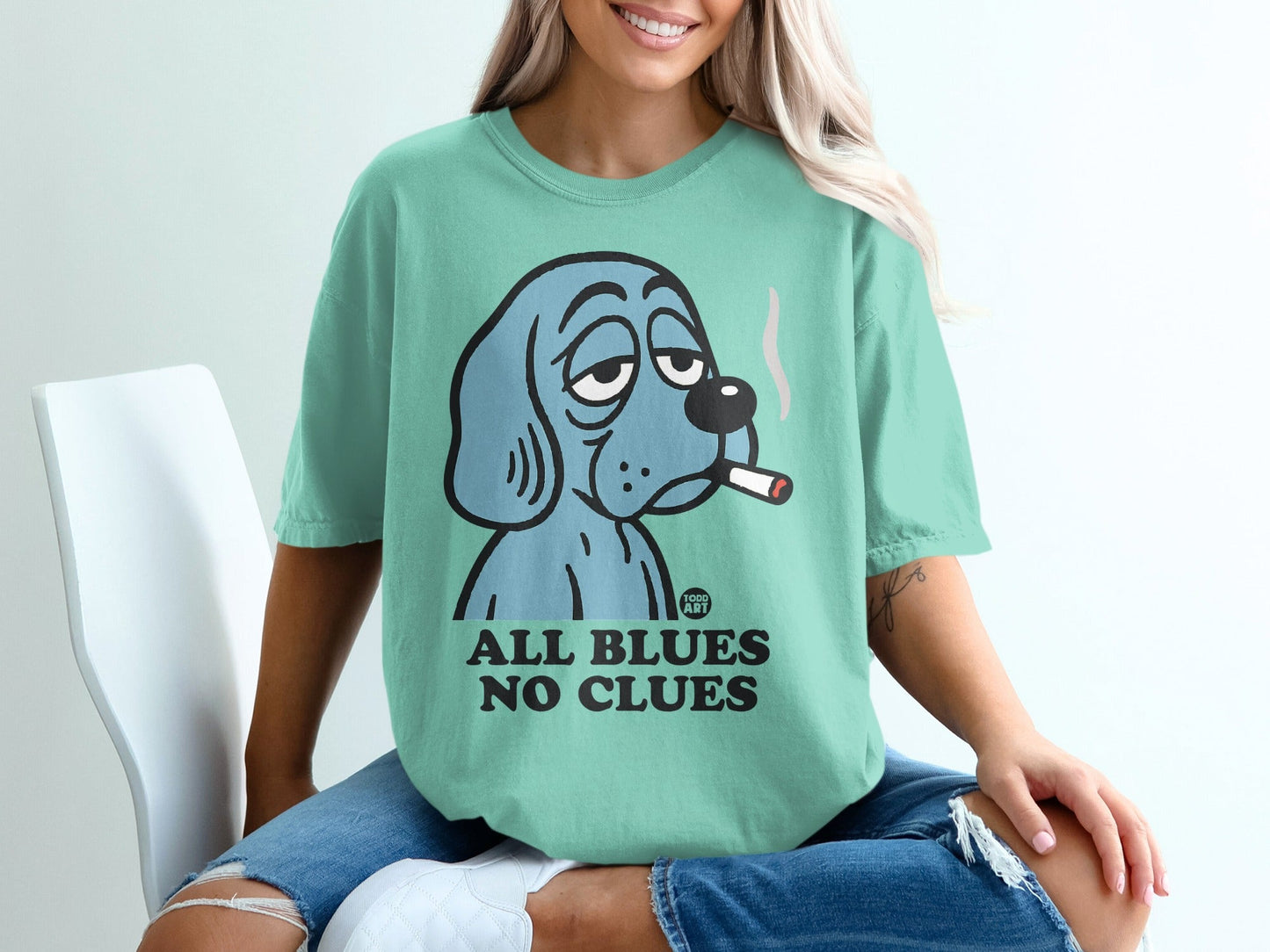 Blue cartoon dog with cigarette, "All Blues No Clues" text.