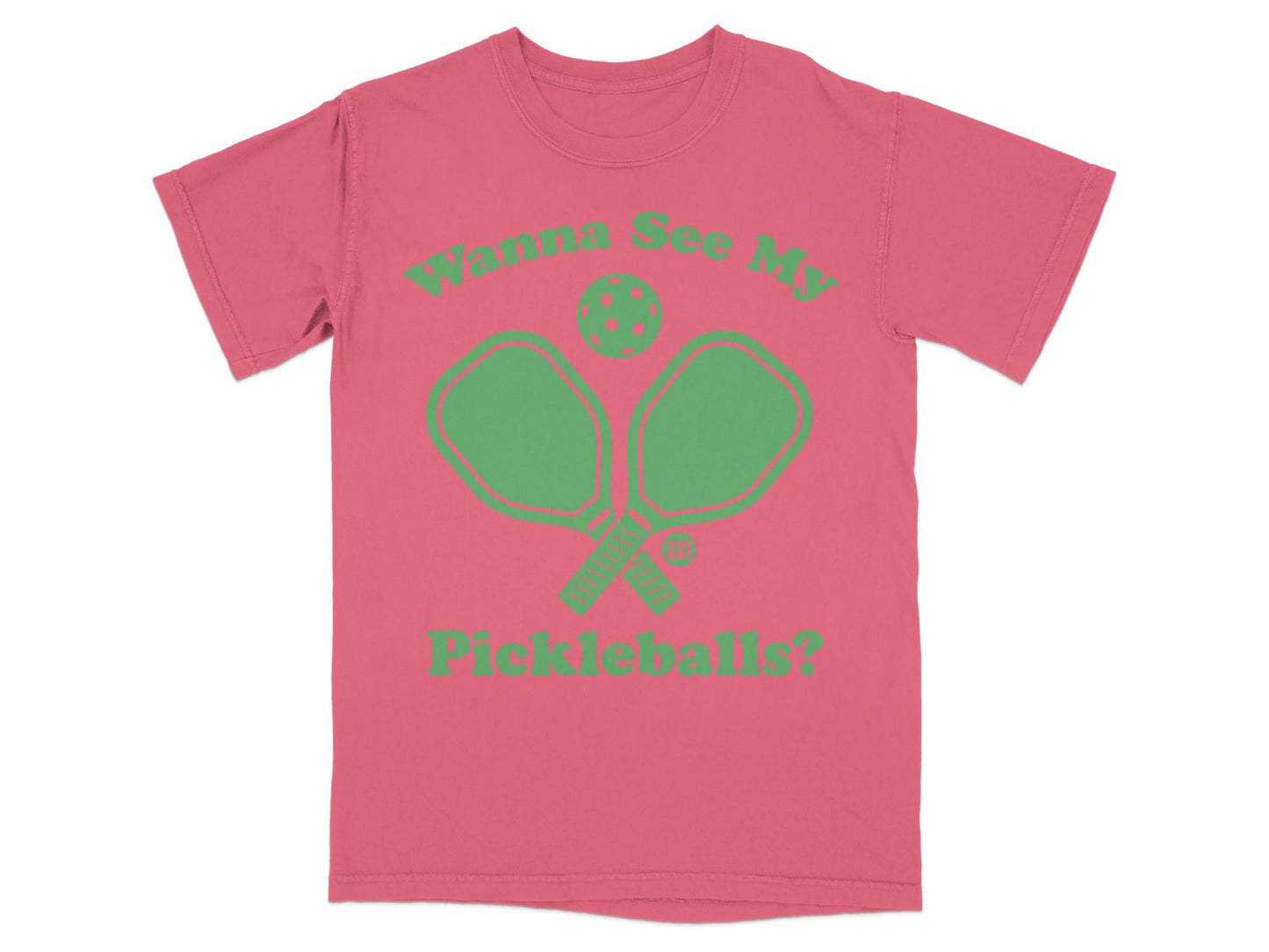 Pink t-shirt with green pickleball paddles and text "Wanna See My Pickleballs?".