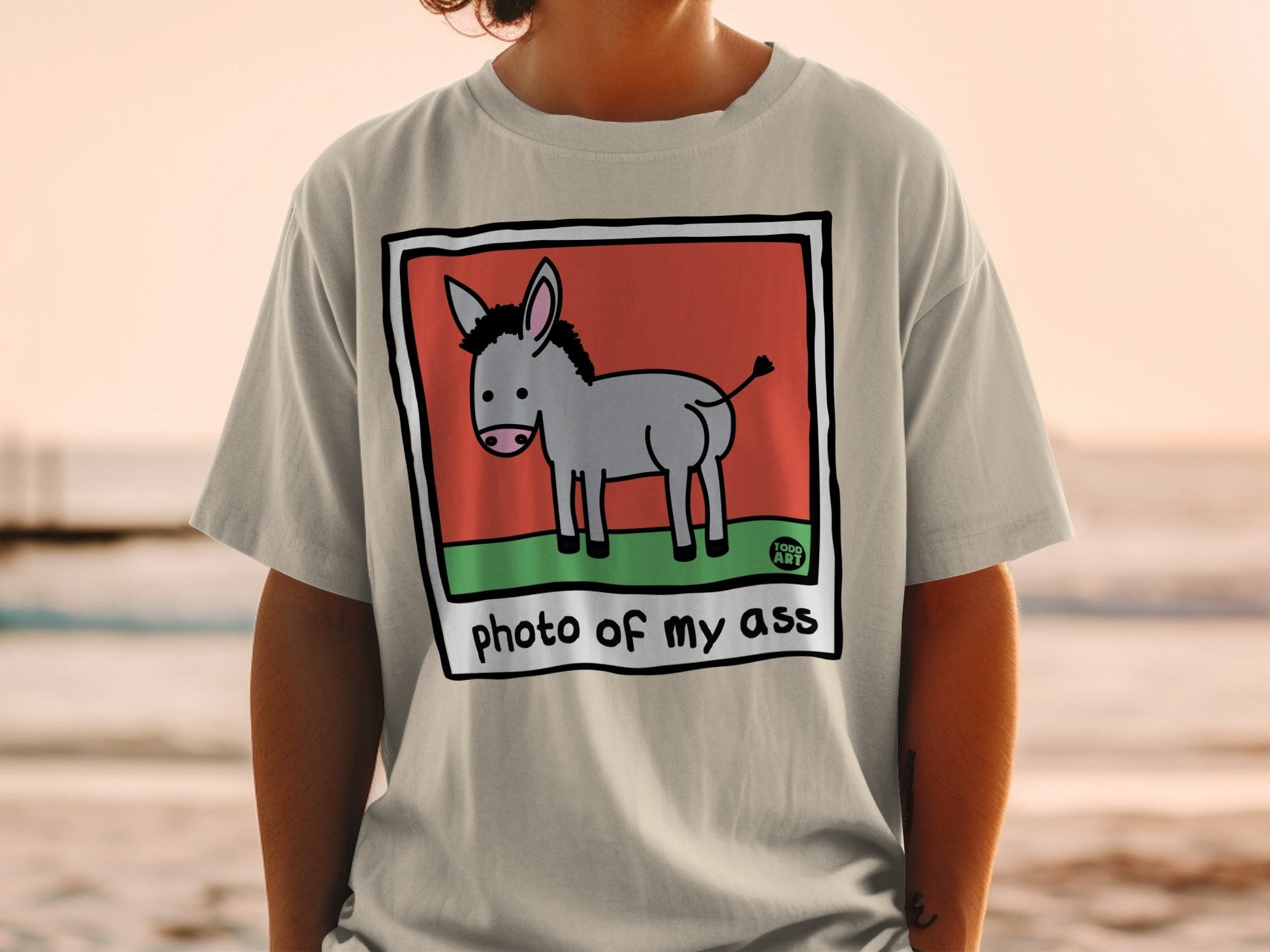 Donkey graphic with "photo of my ass" text on a beige t-shirt.