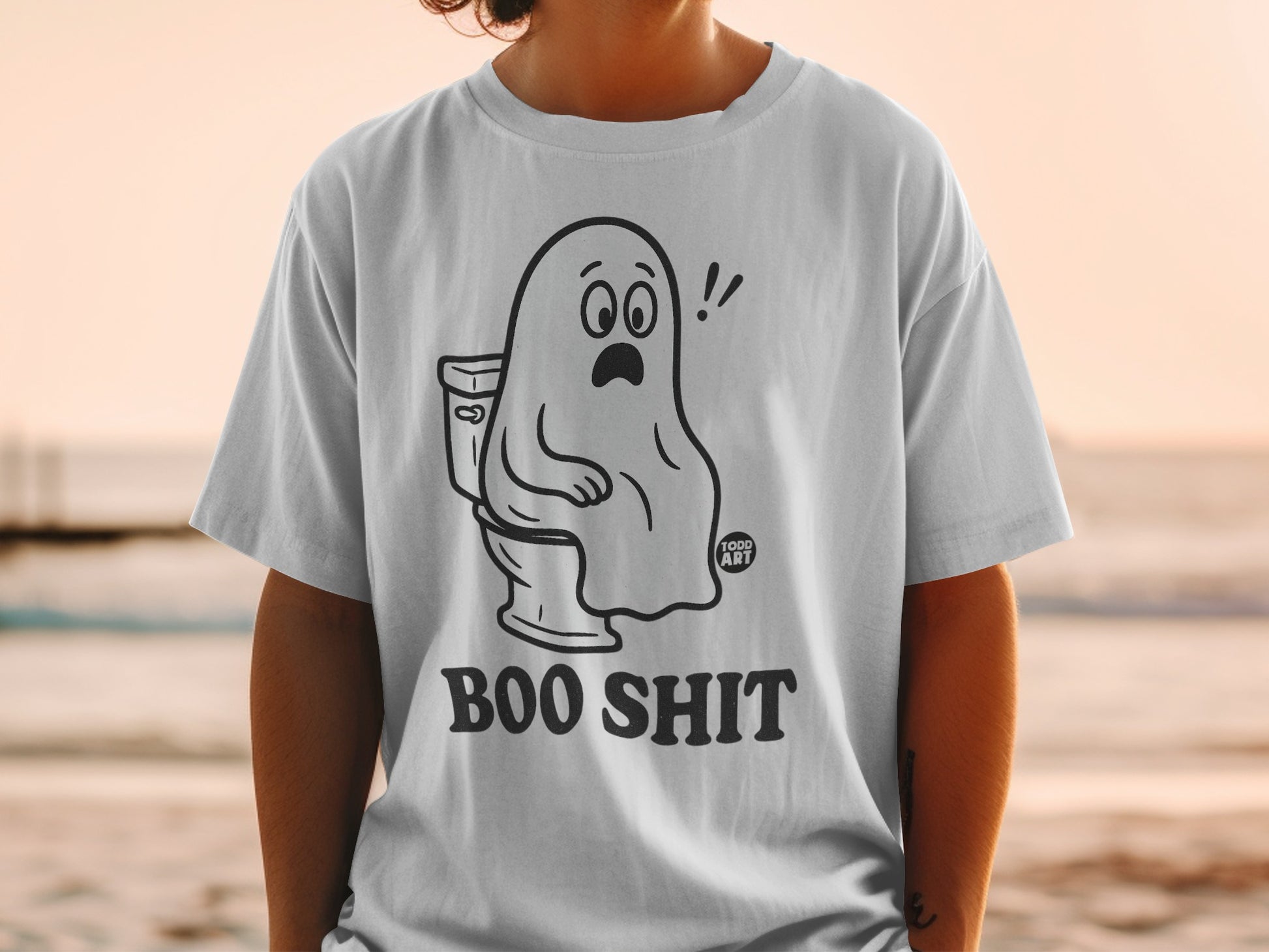 T-shirt with cartoon ghost on toilet, text "BOO SHIT" and "FOOD ART".