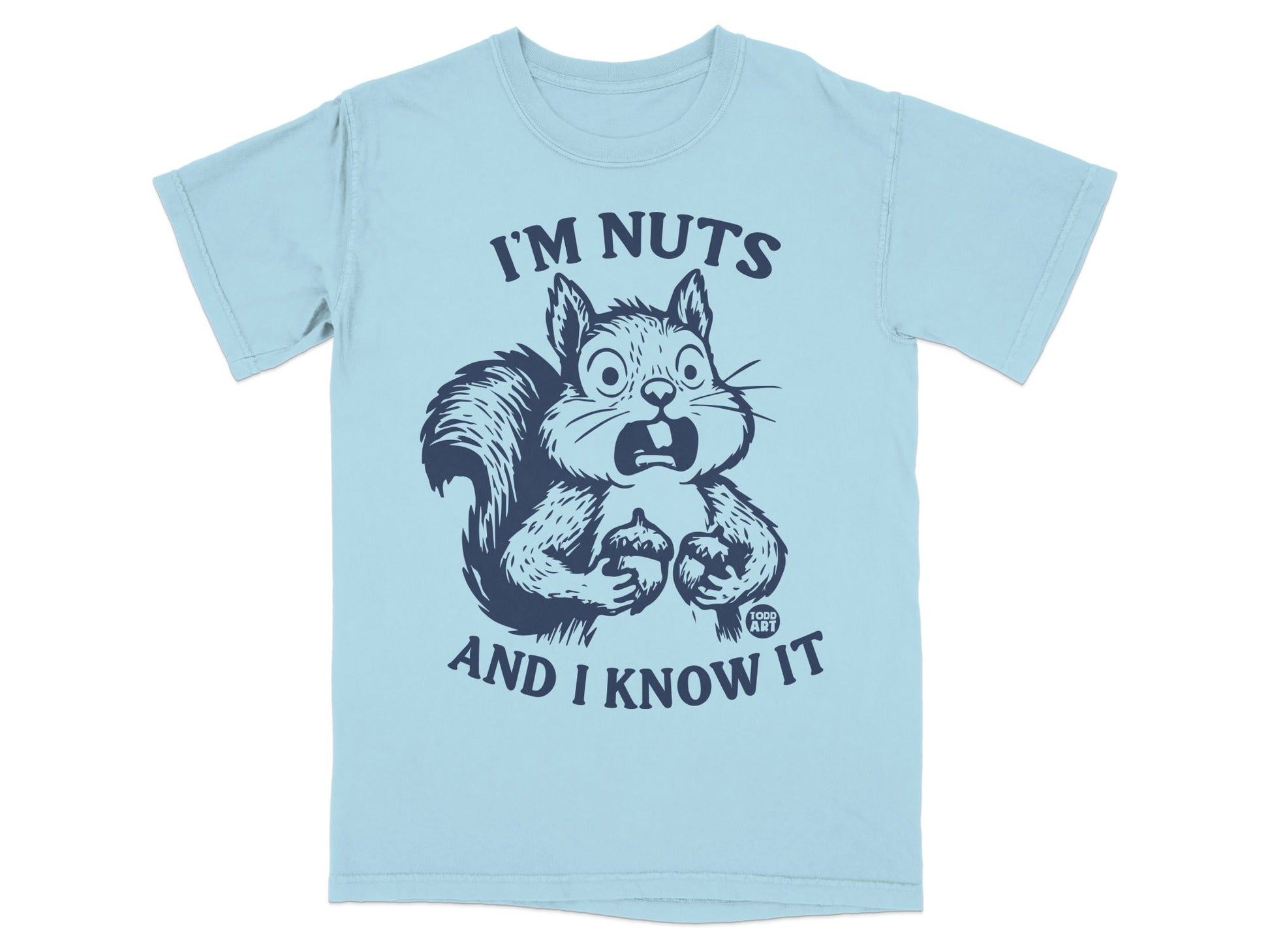 Light blue t-shirt with a startled squirrel holding acorns and text "I'M NUTS AND I KNOW IT".