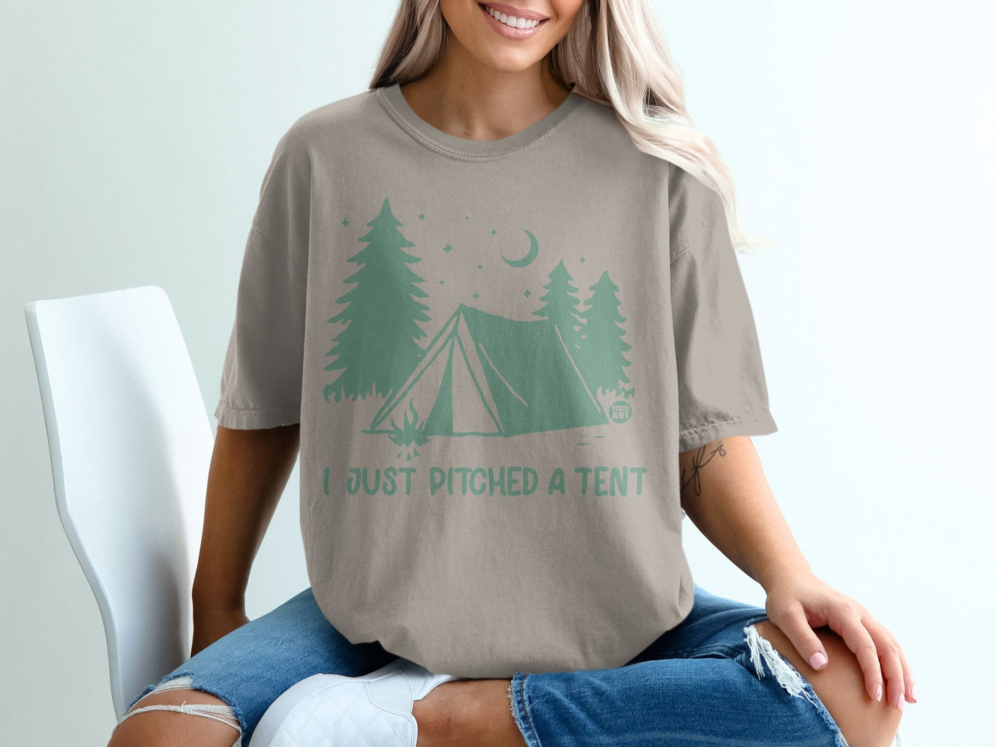 Tan t-shirt with green camping graphic and text "I JUST PITCHED A TENT".