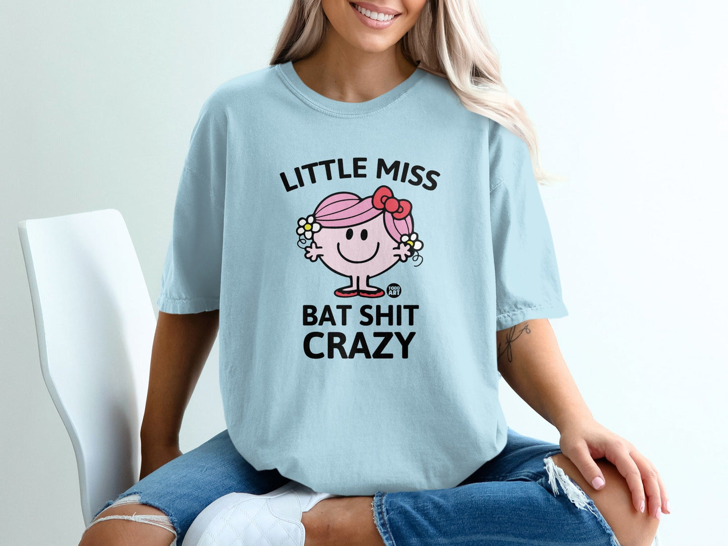 Light blue t-shirt with "LITTLE MISS BAT SHIT CRAZY" text and cartoon character.