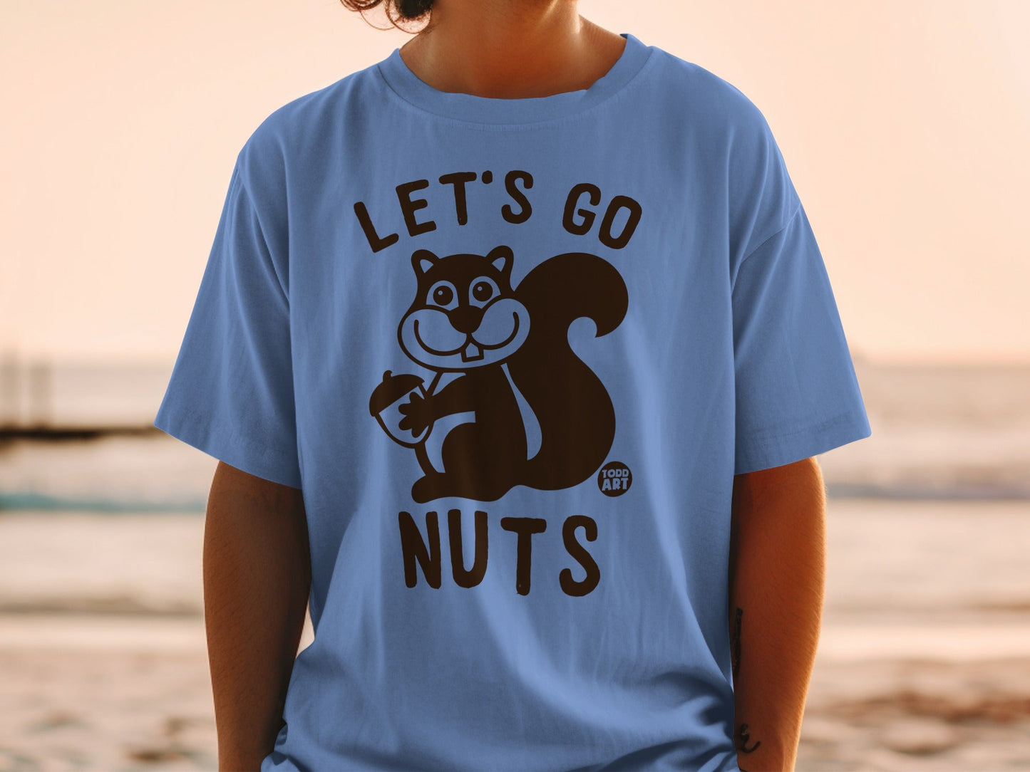 Blue t-shirt with "LET'S GO NUTS" and a squirrel holding an acorn.