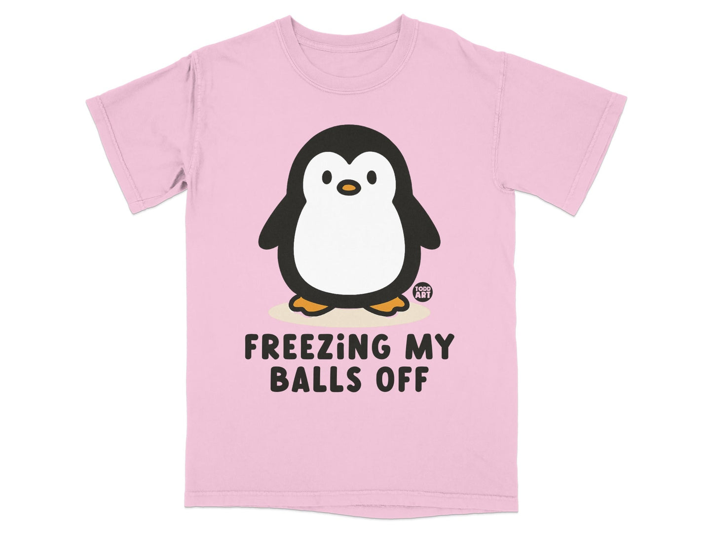 Pink t-shirt with a cartoon penguin that says "FREEZING MY BALLS OFF."