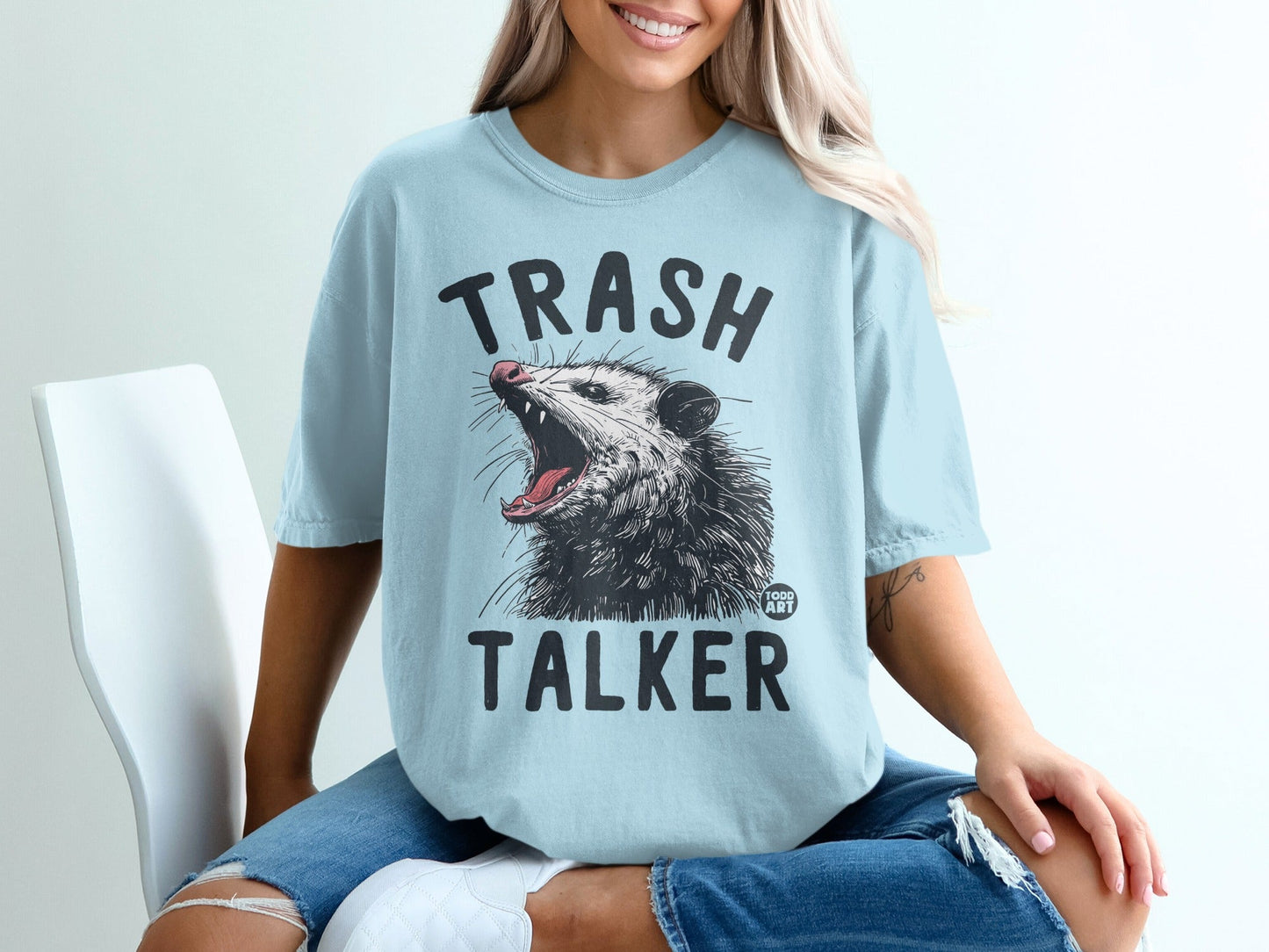 Light blue t-shirt with "Trash Talker" and opossum graphic.