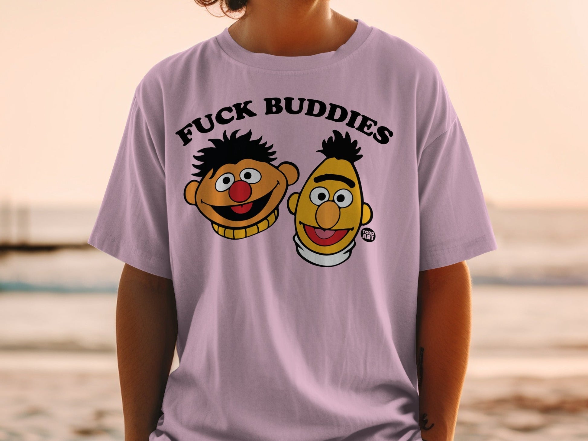 Light purple t-shirt with "FUCK BUDDIES" and characters Bert and Ernie.